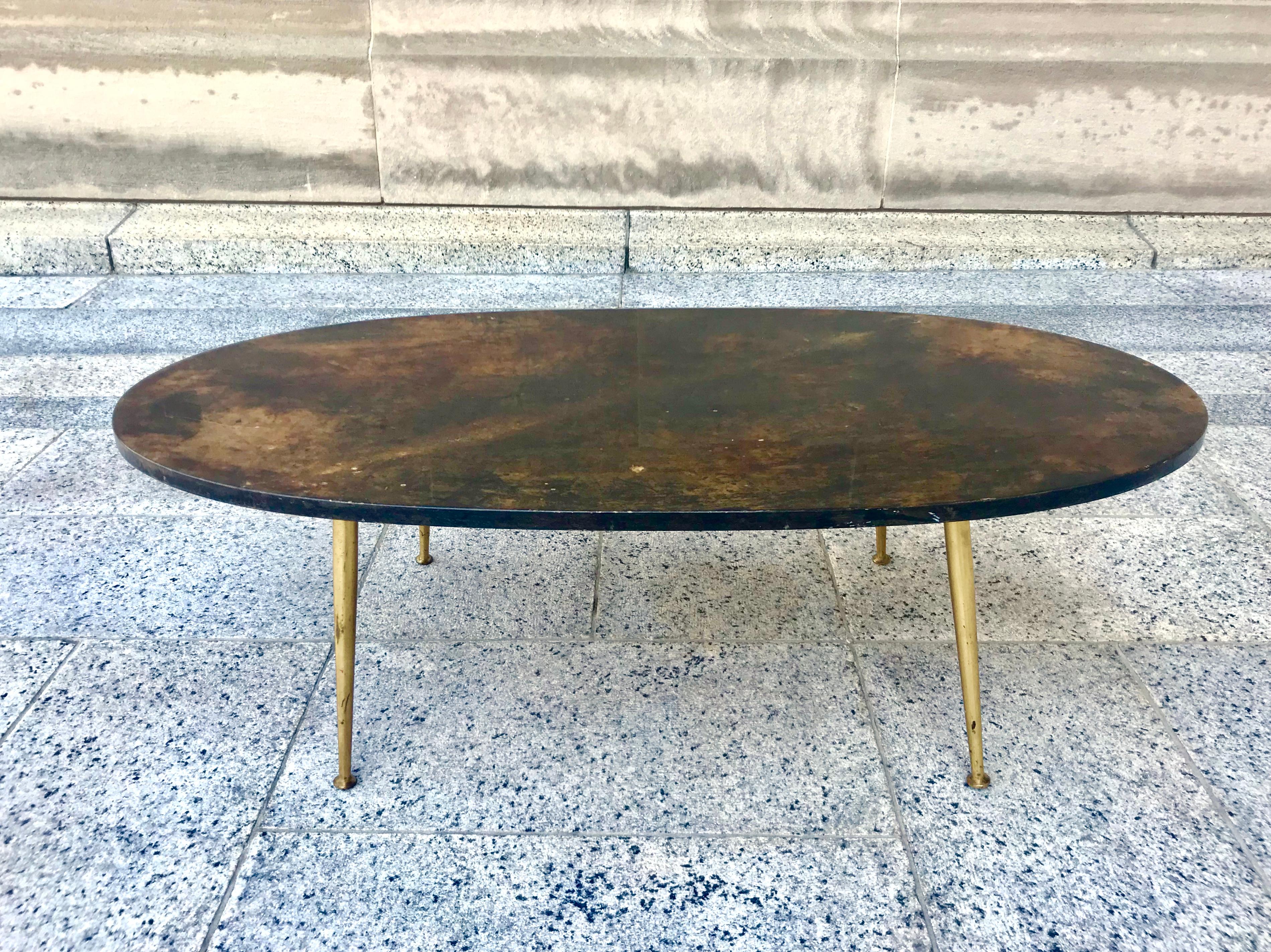 Fabulous and rare 1950s Italian Aldo Tura chocolate lacquered goatskin cocktail table with cast brass legs. We covet these Tura pieces, and this is certainly one of the nicest table we’ve had by him!