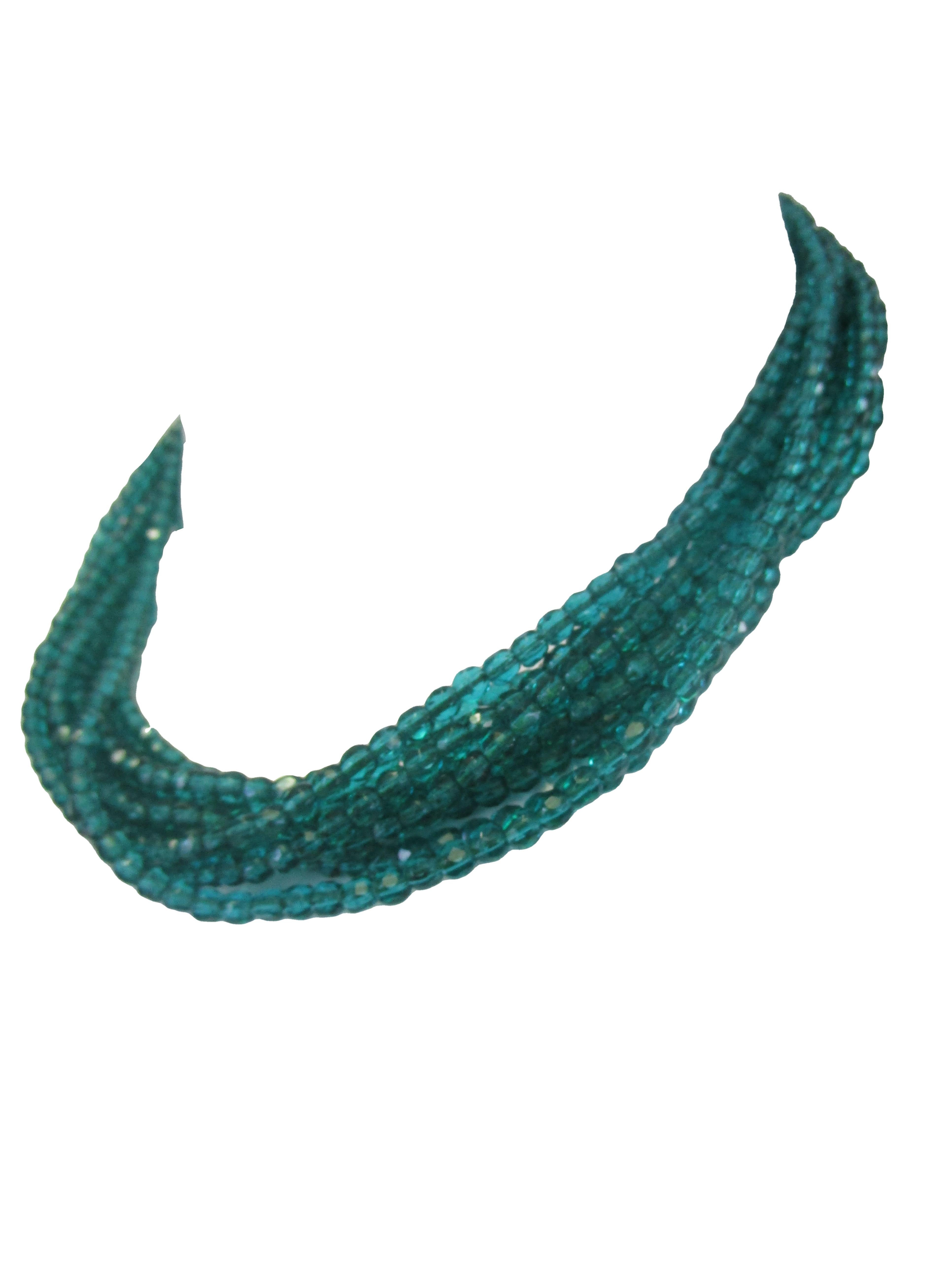 
Beautifully crafted in 1964 choker from Christian Dior! This choker is made with shimmering sea green glass beads that connect to an opulent rhinestone clasp. Christian Dior contracted many jewelry designers throughout his career but in 1955 he