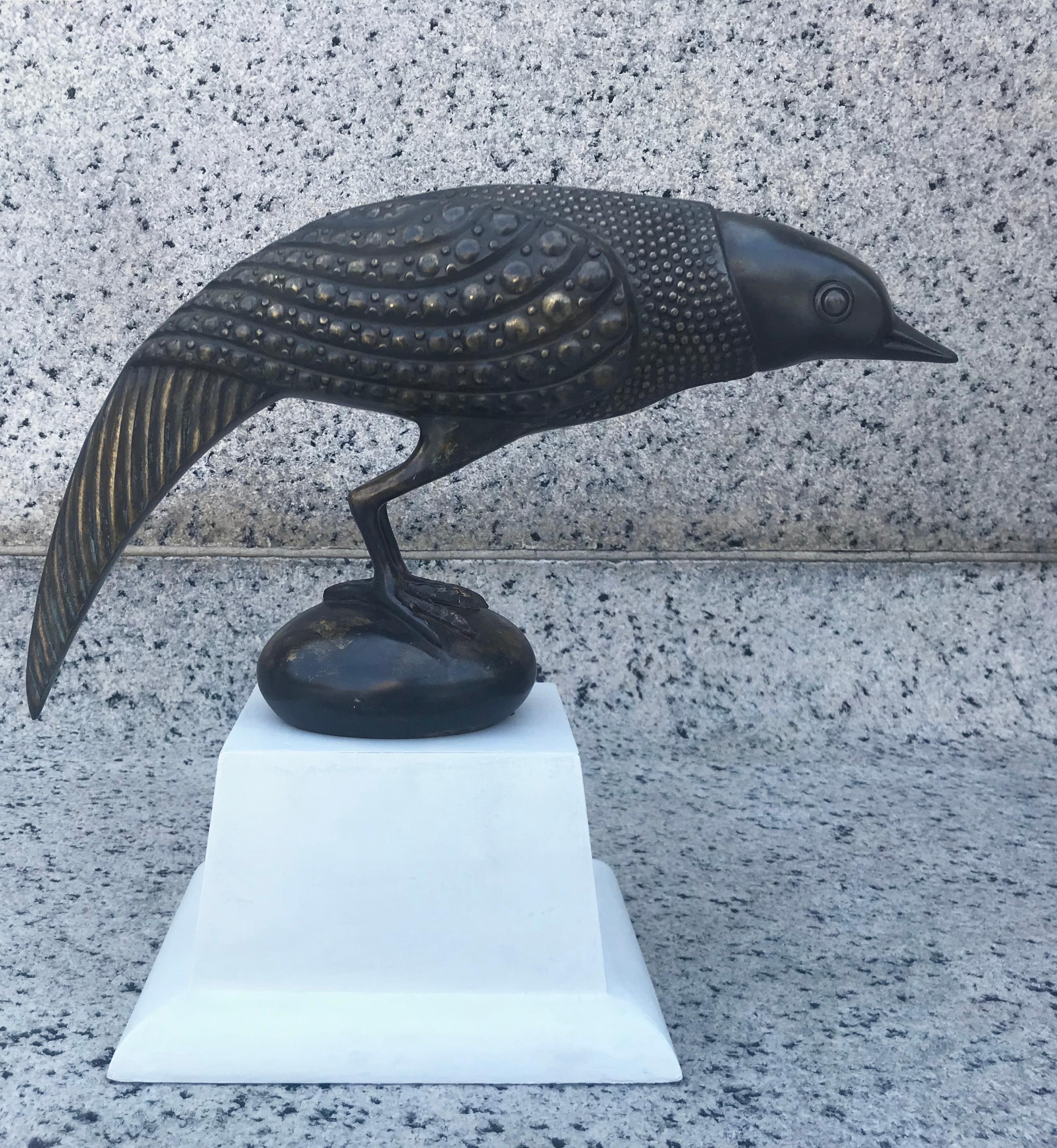 Fabulous 1970s French bronze bird sculpture in the style of Armand Rateau. Mounted on a shaped plaster finish stand. Incredible detail and presence.
