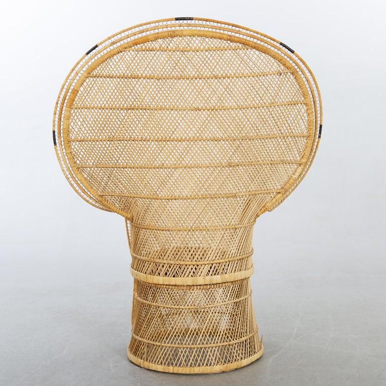 Peacock style Armchair, mid-20th century
Rattan, with fabric cushion, excellent condition for age. Local pick up or delivery available at no cost. 
Seat height approx. 16.5
      
