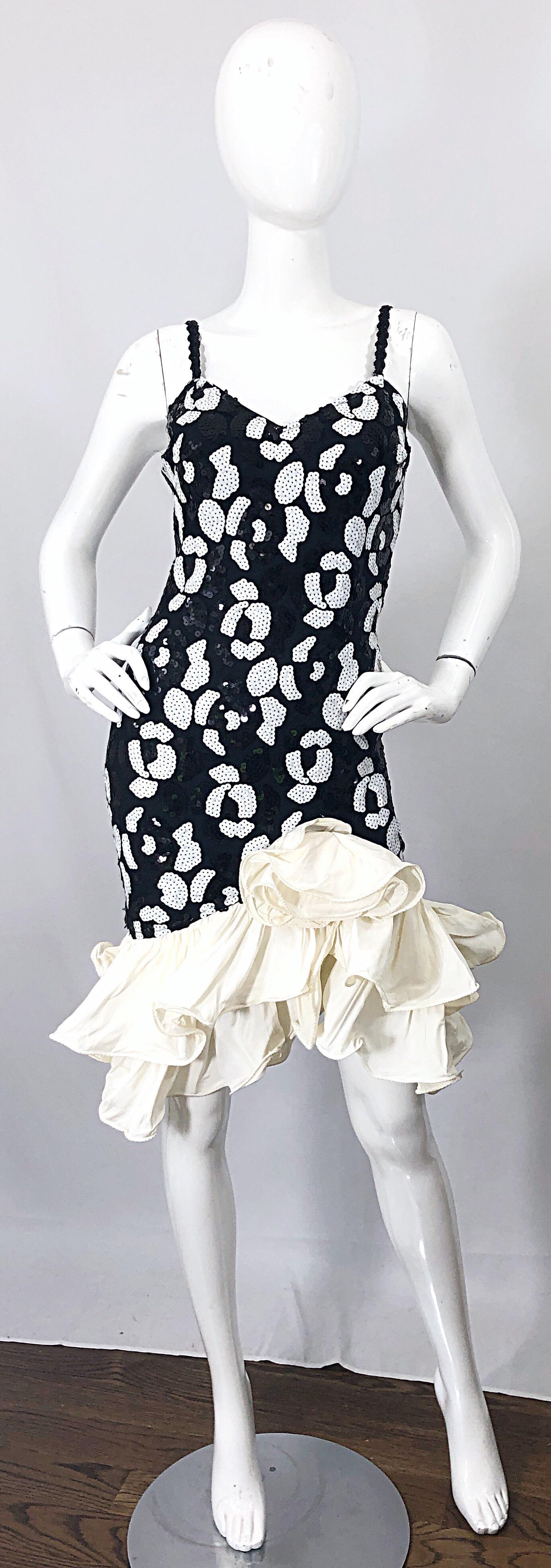 Fabulous late 80s black and white sequined abstract print sleeveless bodcon dress! eateries hundreds of hand-sewn black and white sequins throughout. Avant Garde style with white taffeta poof hem. Hidden zipper up the back with hook-and-eye closure.