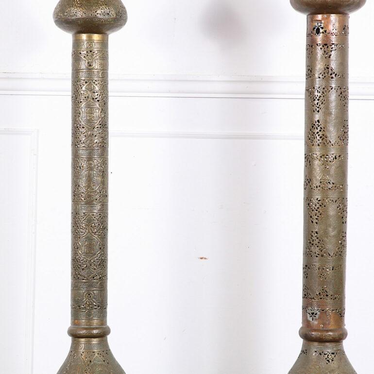 Wonderful pair of Fabulous large matched pair of pierced brass Moroccan solid brass standing lamps. Almost 6' Tall. Mark bought this pair years ago. He saw many photographs of Yves St. Laurents and Pierre Berge’s various residences. All of them had
