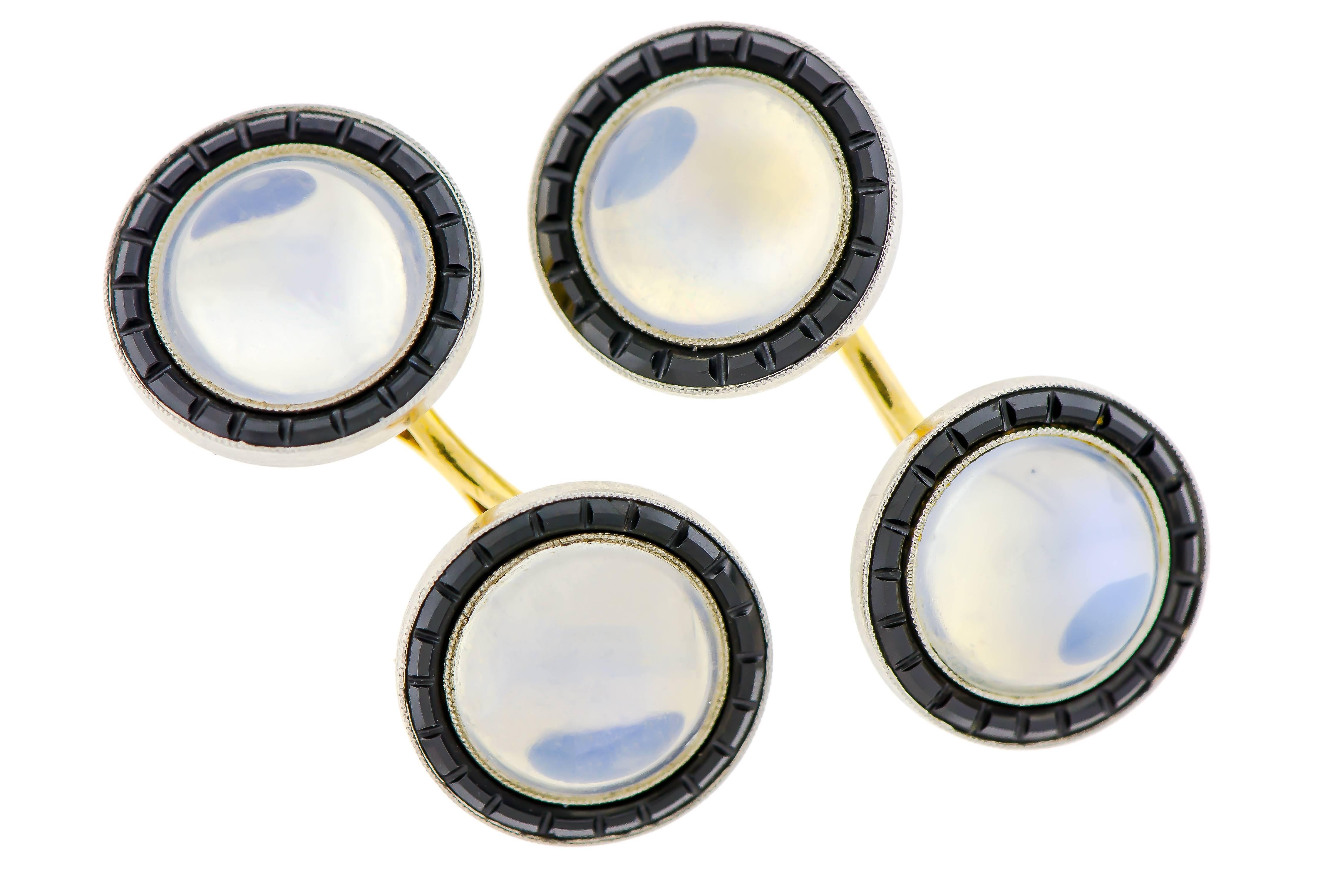 Fabulous and unique Art Deco moonstone onyx and gold double-sided cufflinks containing four (4) 10mm luminous moonstones, The moonstones are surrounded by caliber cut onyx border set in white topped 14kt yellow gold. 