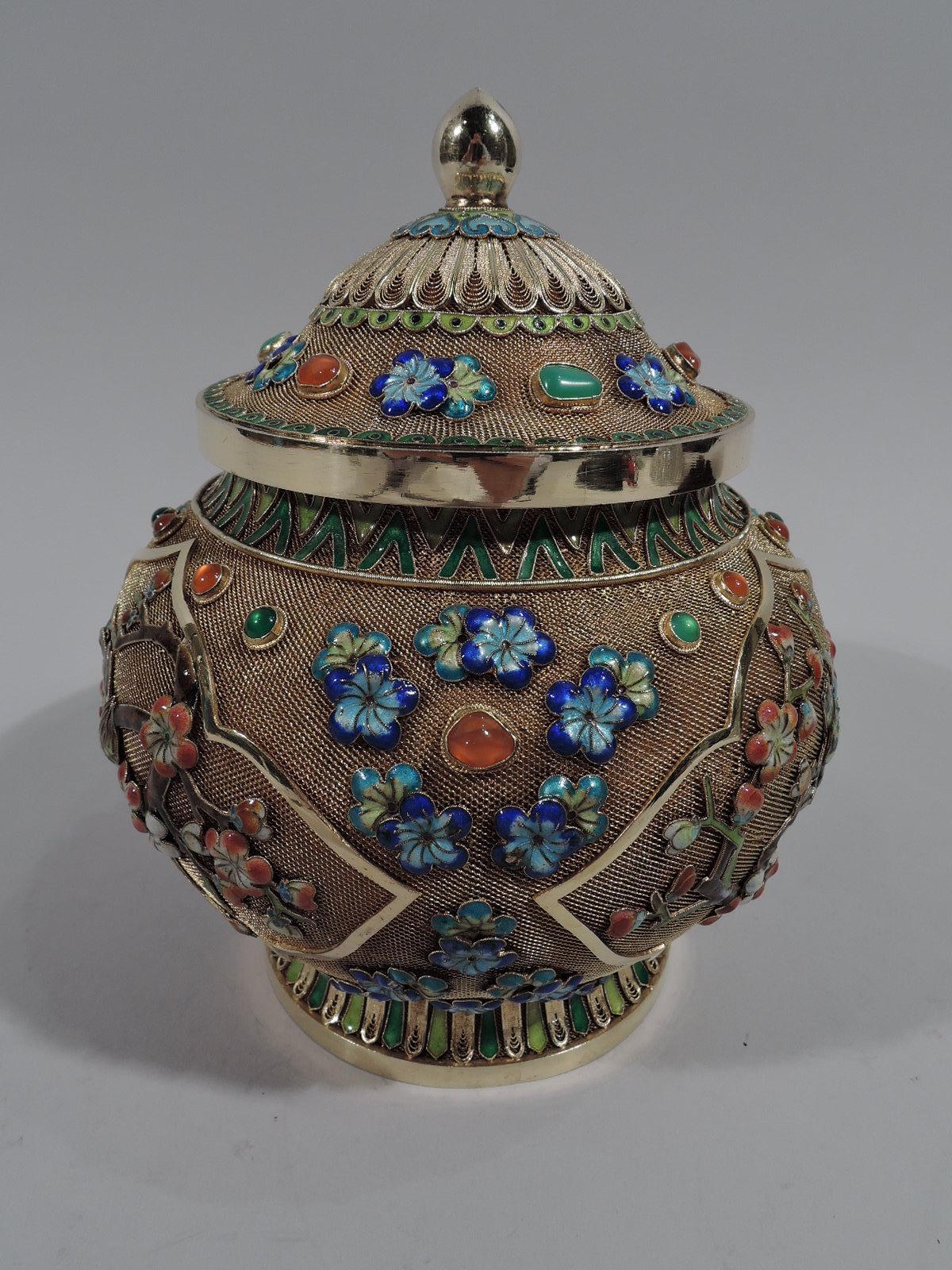 Fabulous Chinese silver gilt and enamel ginger jar, circa 1920. Globular with raised and spread foot and domed foot. Textured gilt ground with enameled ornament: Birds perched on blossoming prunus branches in shaped silver-gilt frames. Also, blue