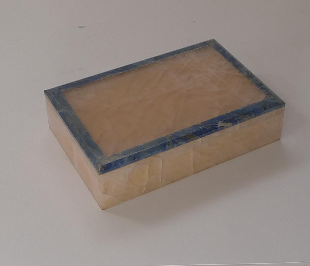 A wonderful early Art Deco box made from highly prized Rose Quartz framed by exotic blue Lapis Lazuli, a winning combination.

Excellent condition dating to c.1920. Measures: 6 1/8