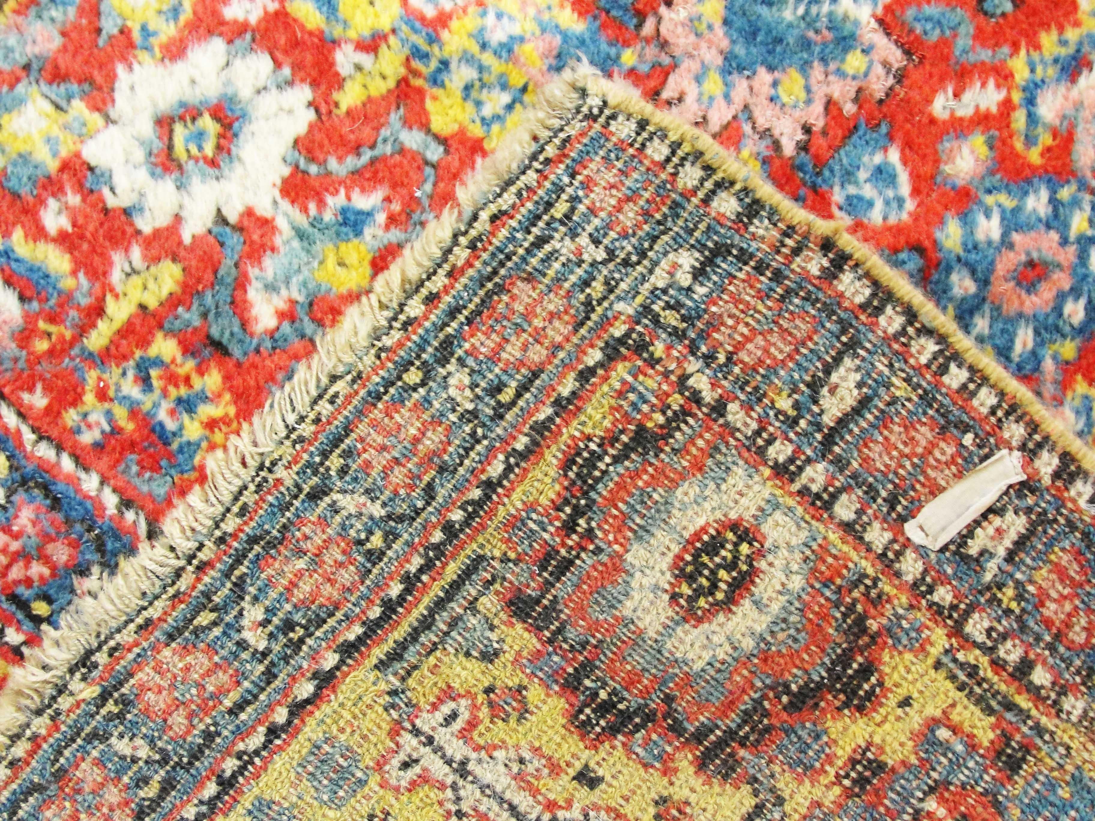 Absolutely gorgeous antique Persian Kurdish Bijar Halvayi runner gallery carpet with wool foundation and beautiful Harrati pattern and Abrash with vegetable dyes in red gold and light blue in excellent condition, circa 1900s.
Bidjar is the name of