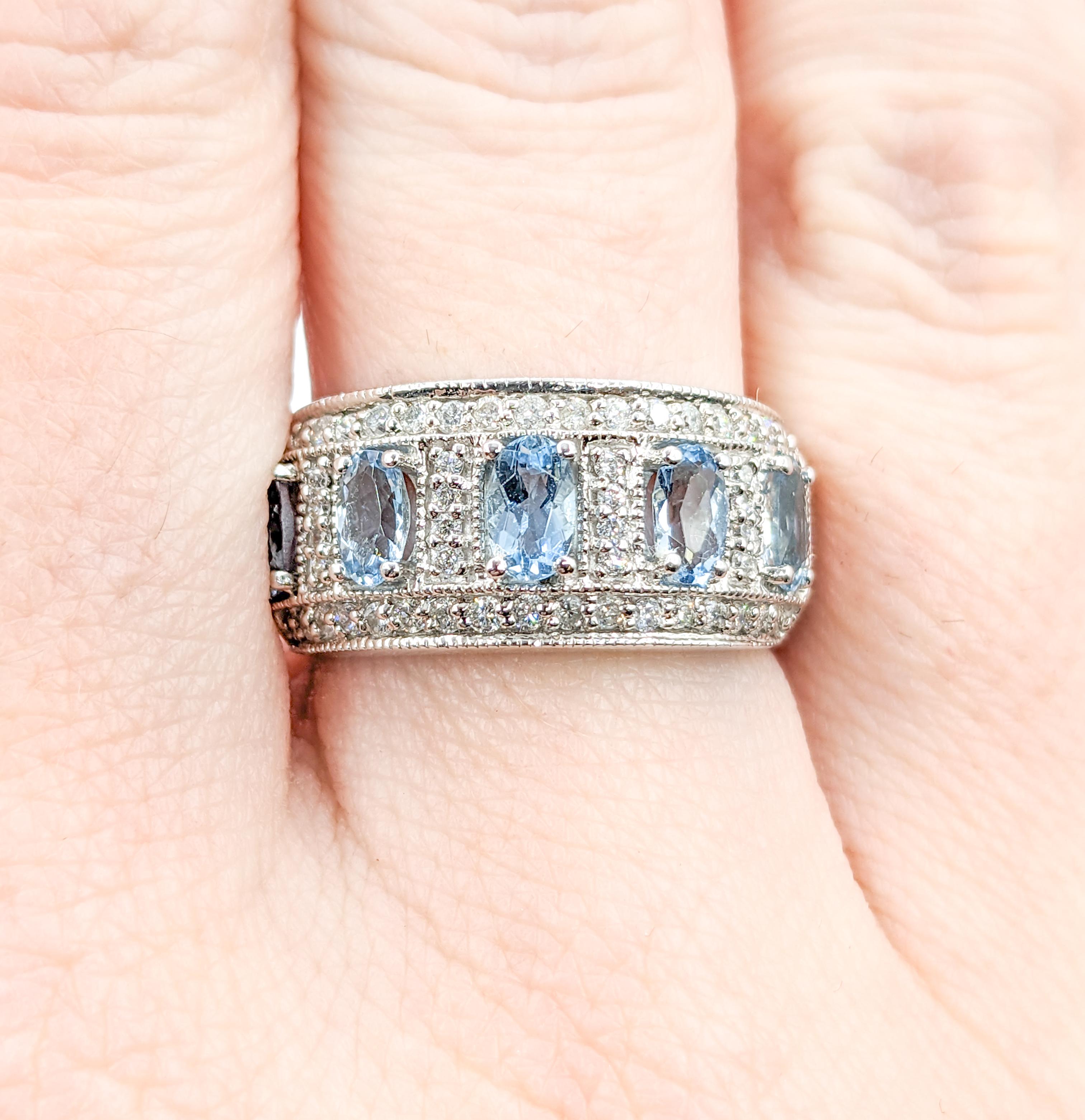 Fabulous Aquamarine & Diamond Wide Band Ring in White Gold

Elevate your style with this exquisite 14 karat white gold ring, a true embodiment of beauty and sophistication. This stunning piece showcases a dazzling 1.0 carat total weight oval
