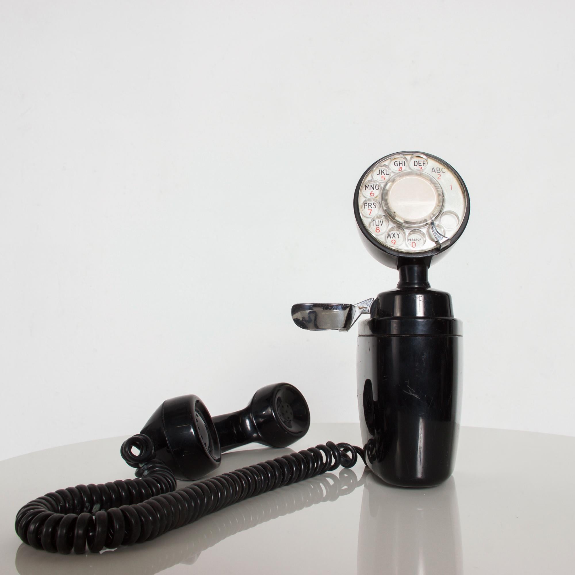 Art Deco American Electric Co black bakelite space saver side hanging rotary dial wall mount phone. Fabulous design.
Model: NB830C
Dimensions: 11.5