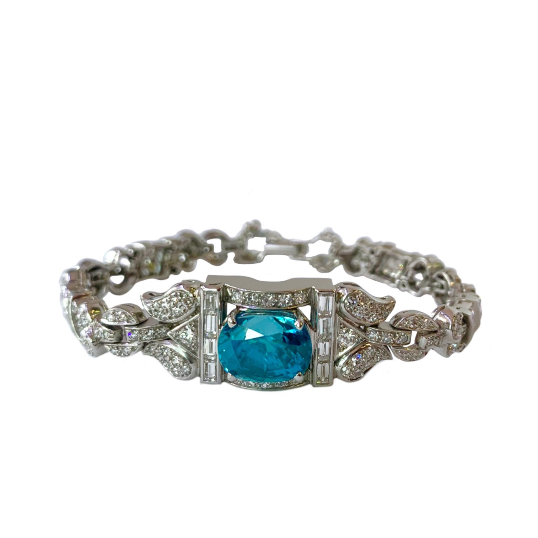 This incredible platinum bracelet was a watch once-upon-a-time.  It is now set with a marvelous approximately 10 carat Cambodian blue zircon! There are 196 gorgeous, very brilliant baguette and round diamonds with a total weight of approximately