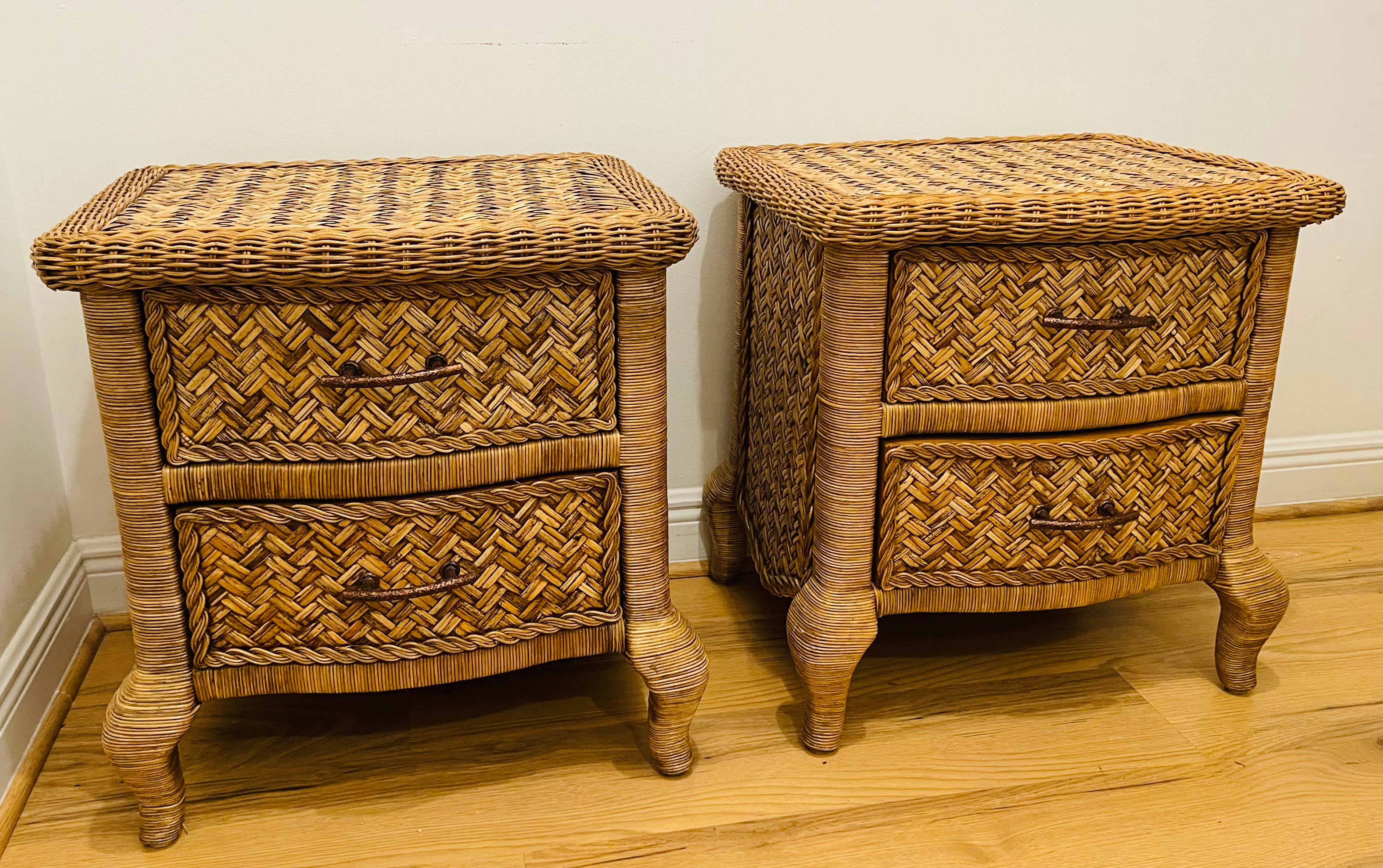 Fabulous pair of braided wicker nightstands. Nice details on the sides and woven top. On curved legs. Great proportions , beautiful pieces of bedroom furniture. Two drawers each on rollers. Great condition.