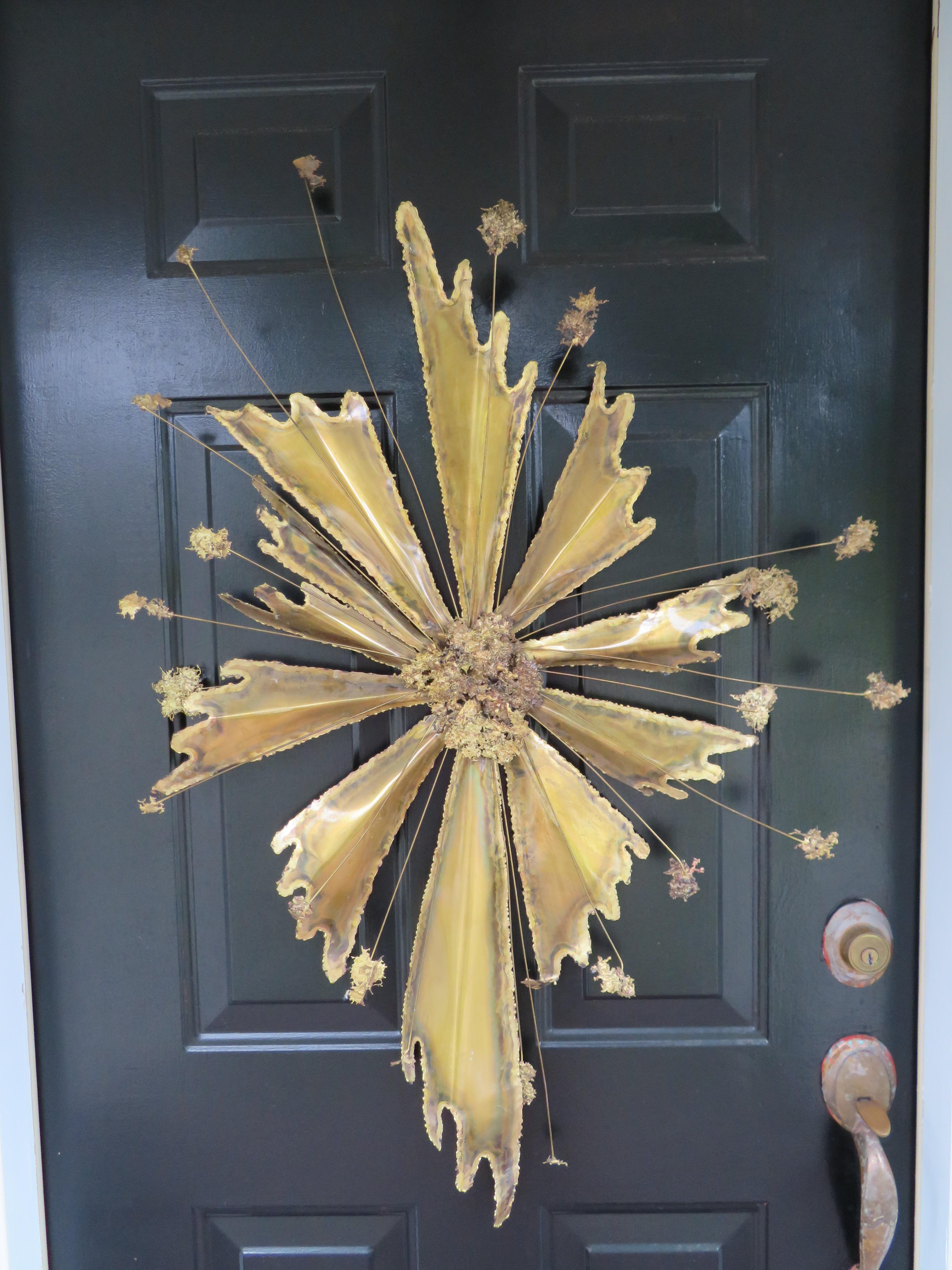Fabulous Brutalist brass wall hanging in the shape of a starburst; California artist Ralph McConnell-signed and dated 1971.