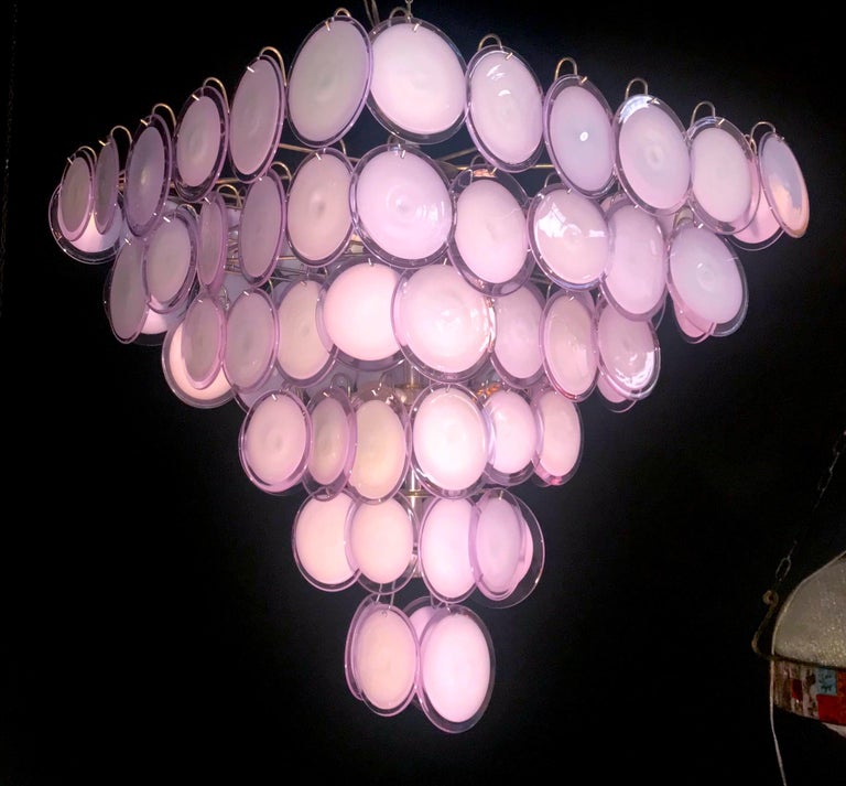 A chandelier of rare beauty and elegance. 87 Murano glass discs Amethyst by Gino Vistosi, disposed in six rows, forming a pyramid. A pair is available.
