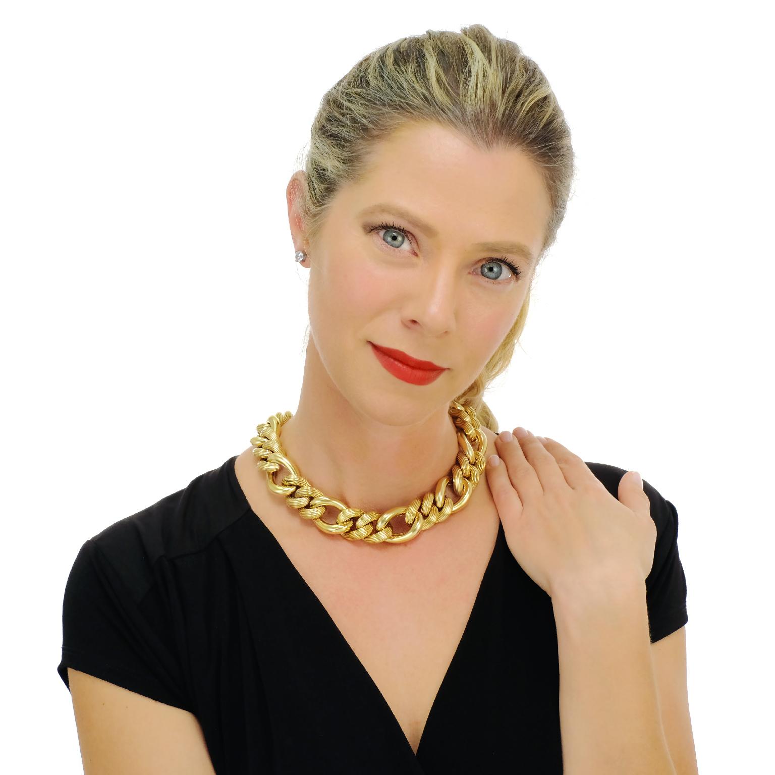 Circa 1960s, 14k, Italy.   This boldly elegant sixties necklace is the perfect signature accessory. The delightfully heavy links have a chic, chunky design underscored by an alternating polished and fluted finish. At 16 3/4s inches long, it is