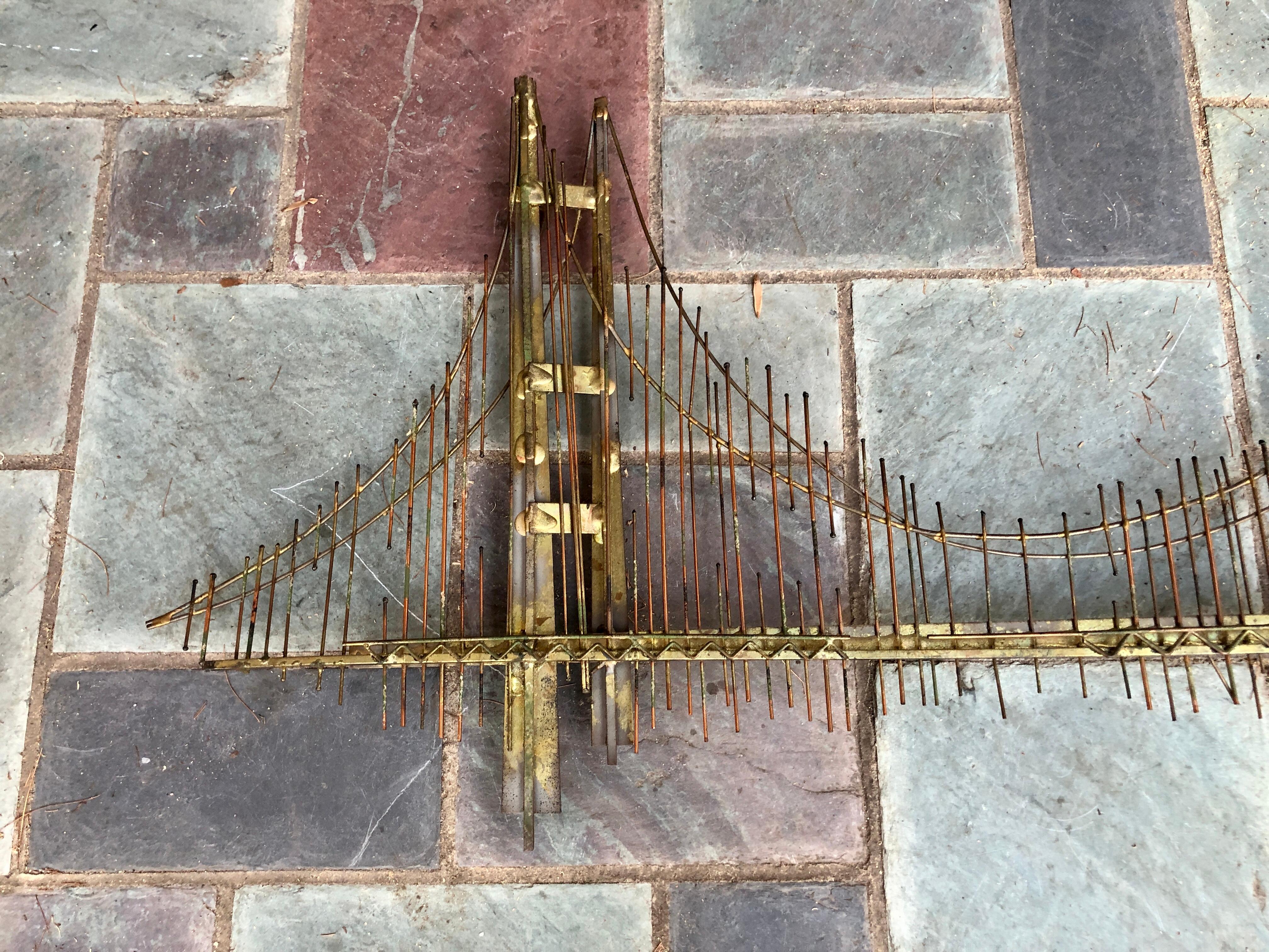 Fabulous original brutalist Curtis Jere Golden Gate bridge wall sculpture. 
Signed by Curtis Jere, Iconic MCM 70's brass and mixed metal wall sculpture.  This piece measures 32'' h x 58'' w x 2''d
