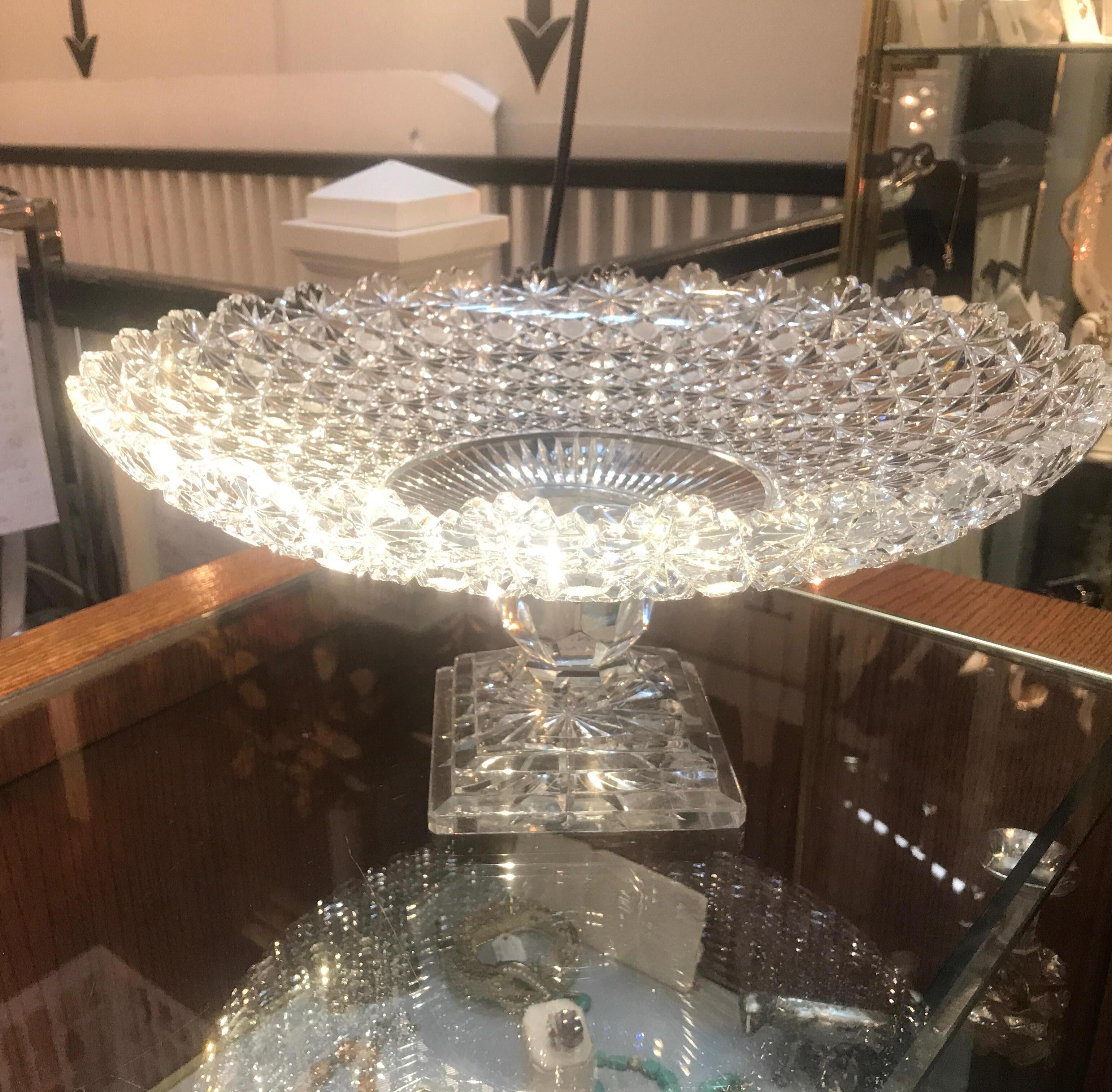 Breathtaking American brilliant cut glass centre bowl compote on pedestal base. Exceptional master cutter piece with thousands of crisp mirror like details all around. The faceted sphere stem resting on a square cut stepped plinth base.