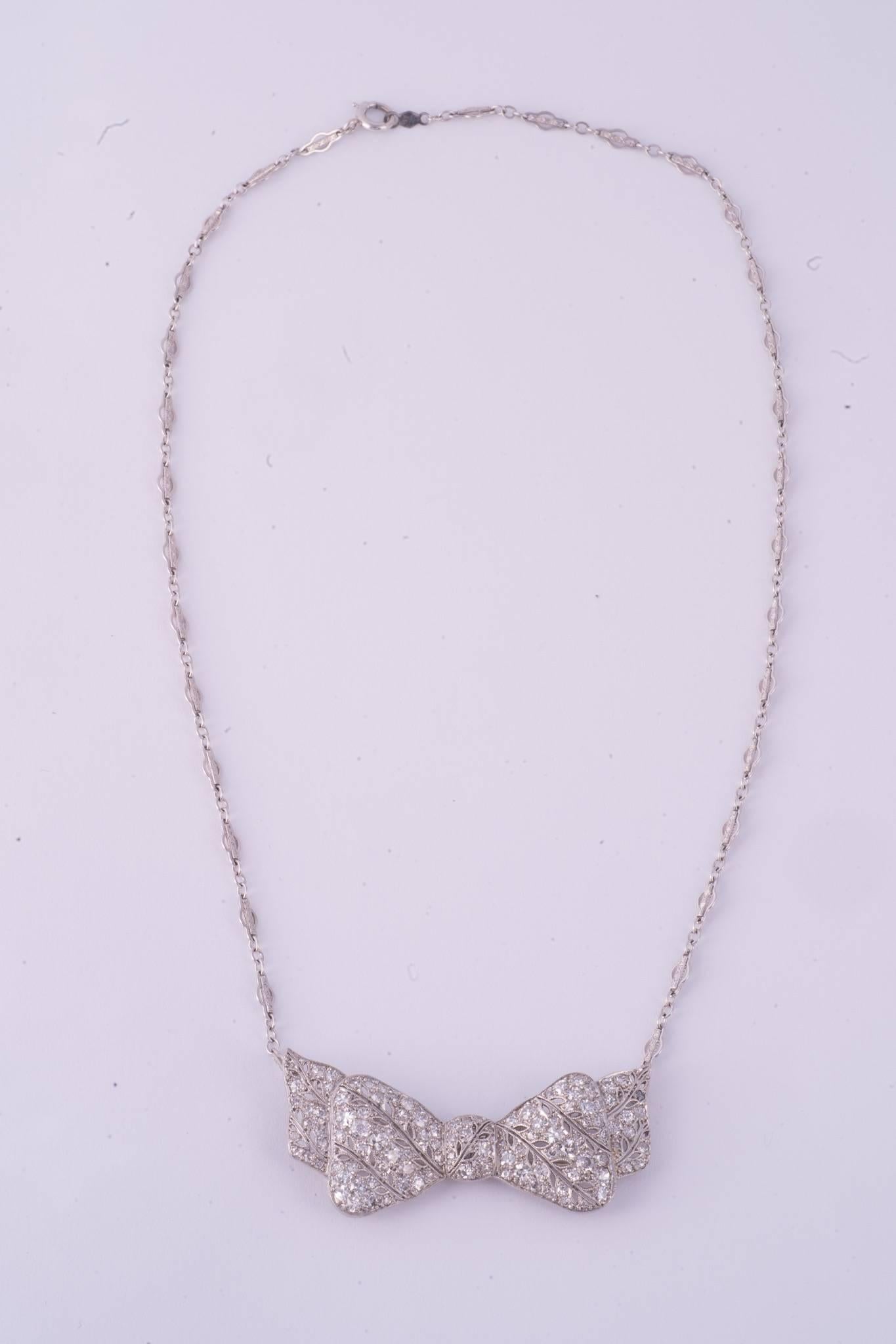 Art Deco Dimaond Bow Necklace. The there are 105 diamonds and they weigh approx. 5.05cts . the necklace is platinum. Chain comes off to wear as a brooch.