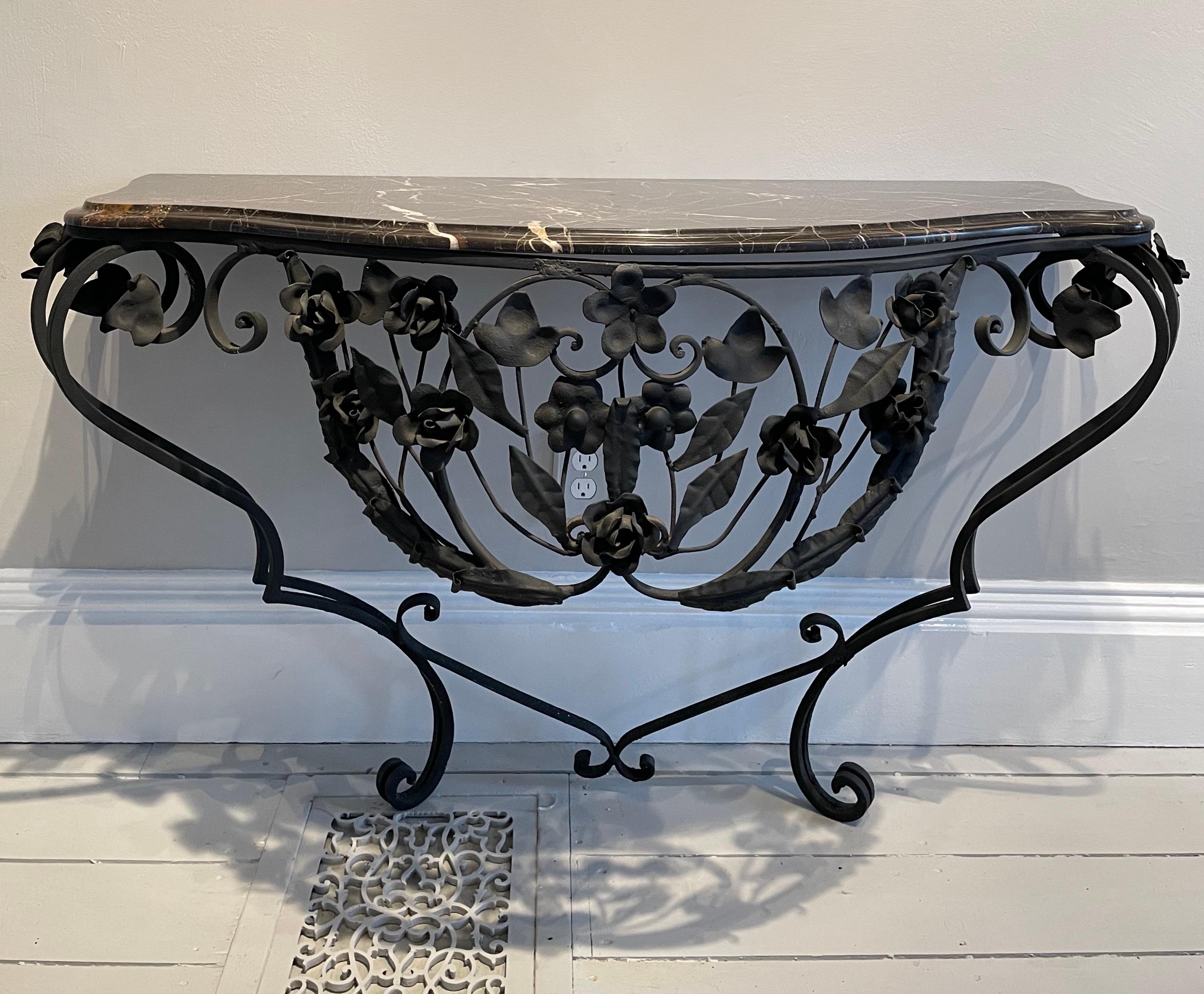 This is a striking console with its bombé form and luscious espresso-colored marble top. In addition, one can raise or lower the height at will, as the table attaches to the wall and bears no weight on the ground. The newer marble top has cream and