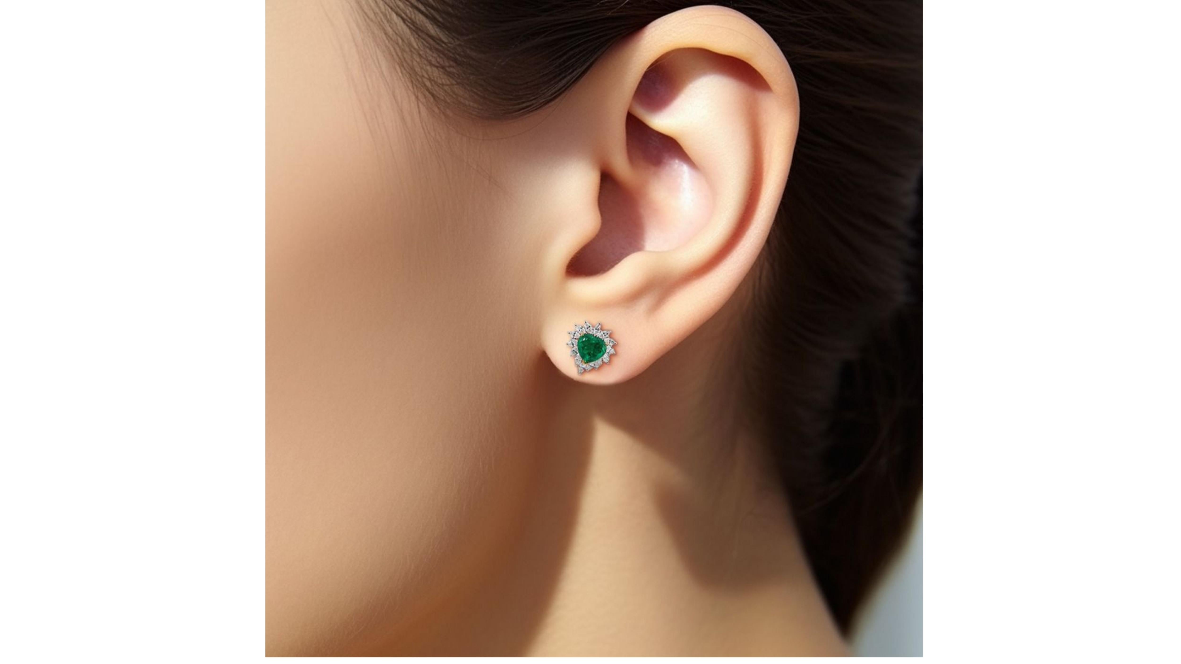 Main stone: Emeralds
cut: Heart Cut
Side Stone: Diamond
cut: Round cut
18k White Gold  

Package Contents:
~ Diamond Ring
~ Invoice 
~ Certificate * (if available)
~ Dianoche Jewellery Box

SKU: GMJ-003-Emerald Earrings