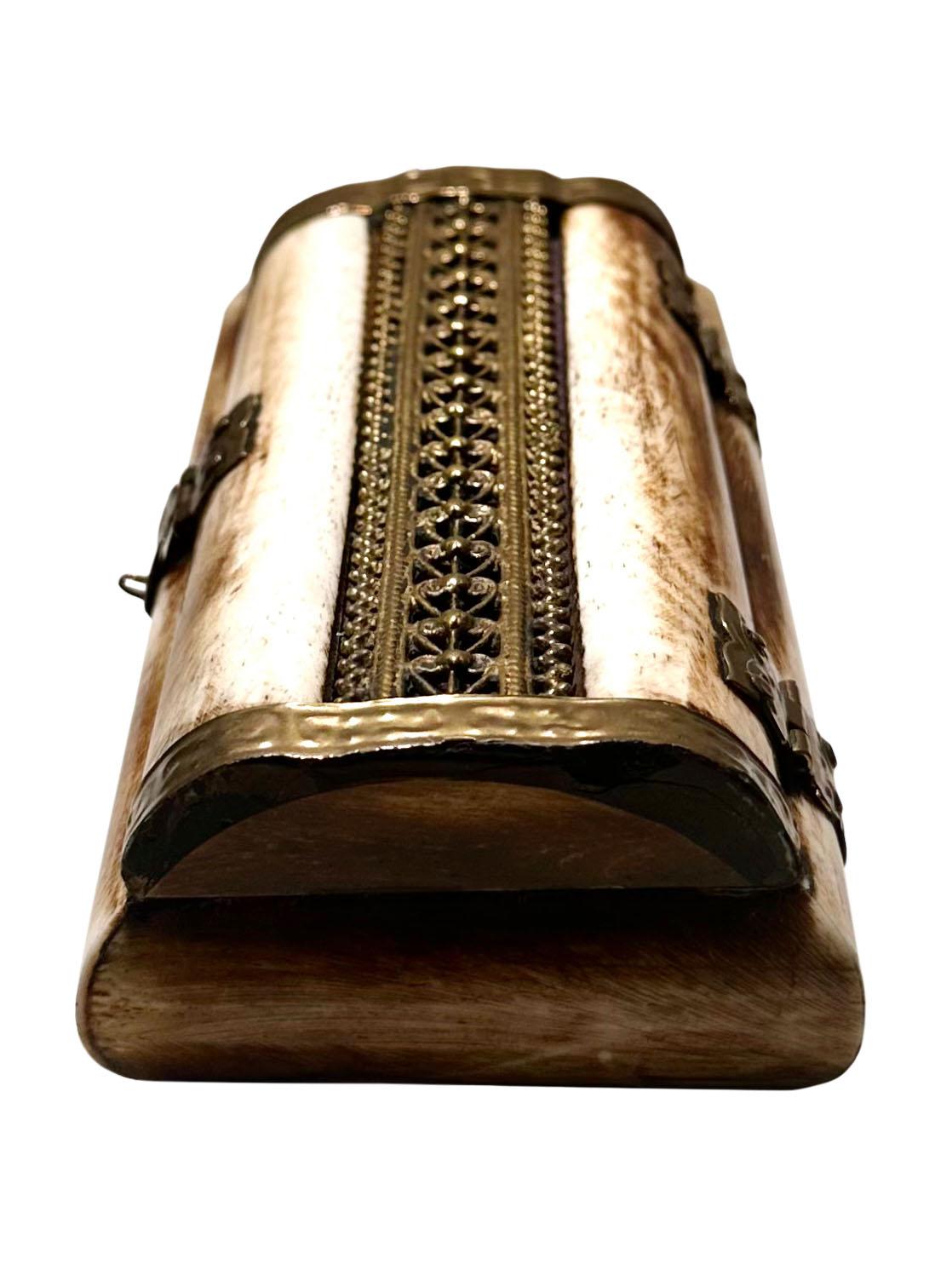 Fabulous Indian box made of bone and pierced brass with a wood bottom.A very nice design. Turn of the century, India.