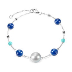 Fabuleux bracelet à breloques en or blanc et lapis-lazuli avec lazyrit et nacre pour elle