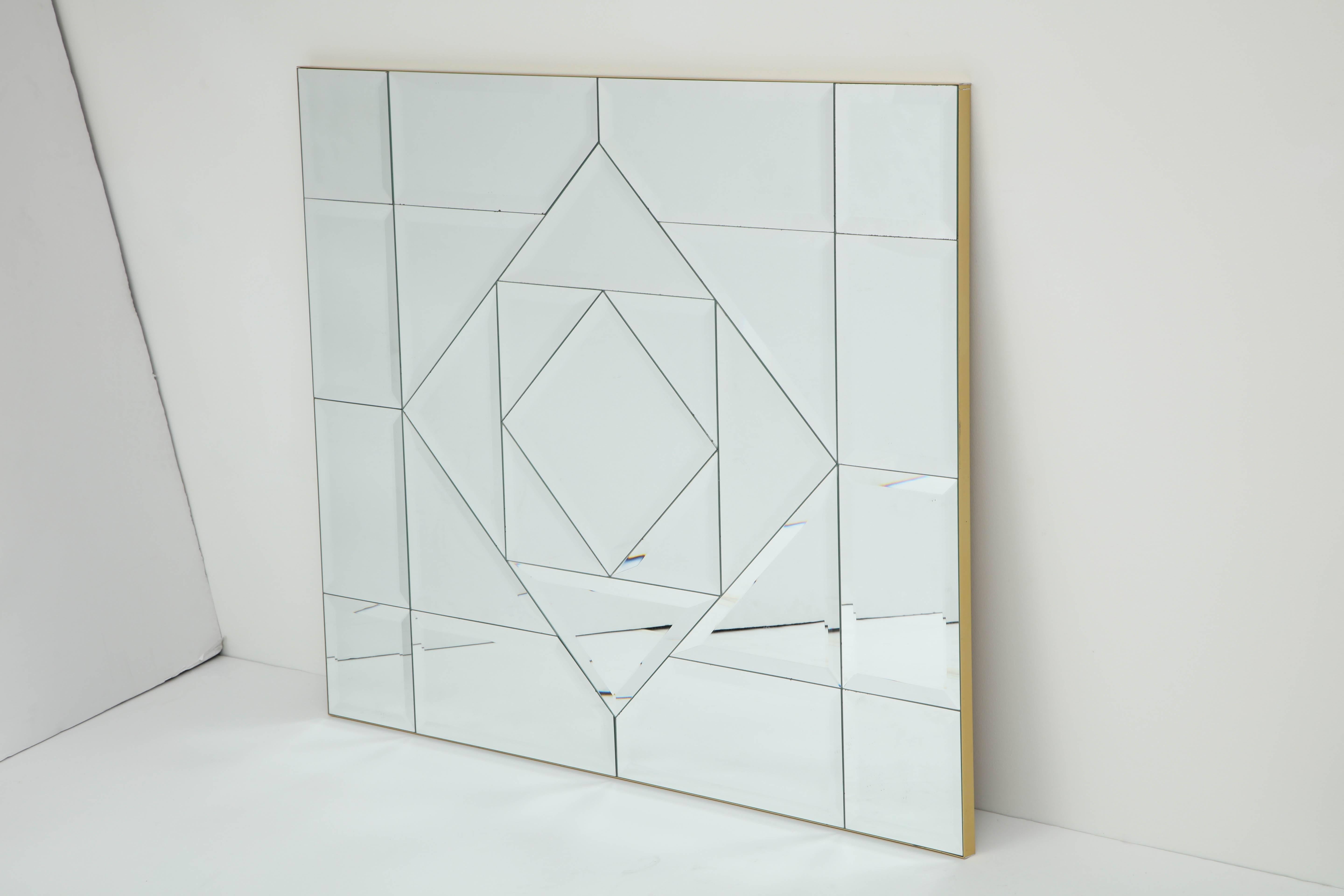This Fabulous large designed mirror has been beautifully executed with bevelled and faceted edges and has been framed in a satin brass frame.
The mirror comes complete with a hanging cleat and it can be hung horizontally or vertically.
There is a