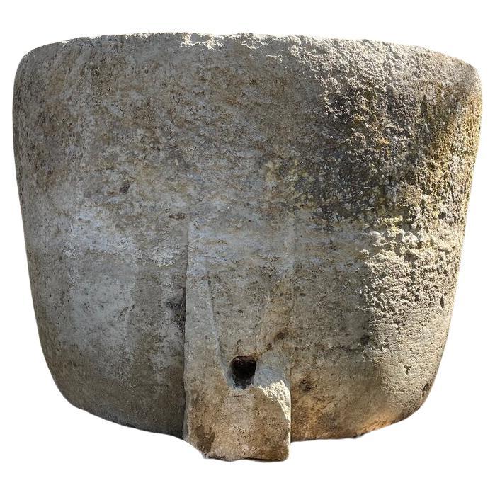 One of the finest troughs sourced on a recent buying trip to France, this stunning very large hand-carved round limestone trough is in excellent antique condition and full of fossils, which makes it very durable. It has no cracks or repairs and is