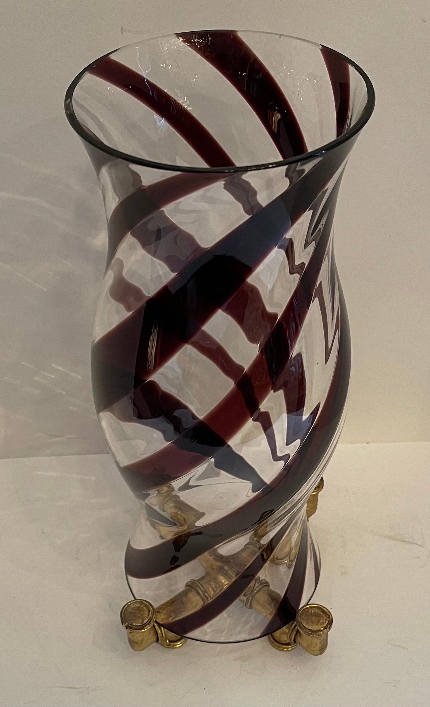 A fabulous modern Italian Murano Hurricane hand blown urn-shaped glass shade with a red swirl motif resting on gold gilt bamboo form base (Base measures 6