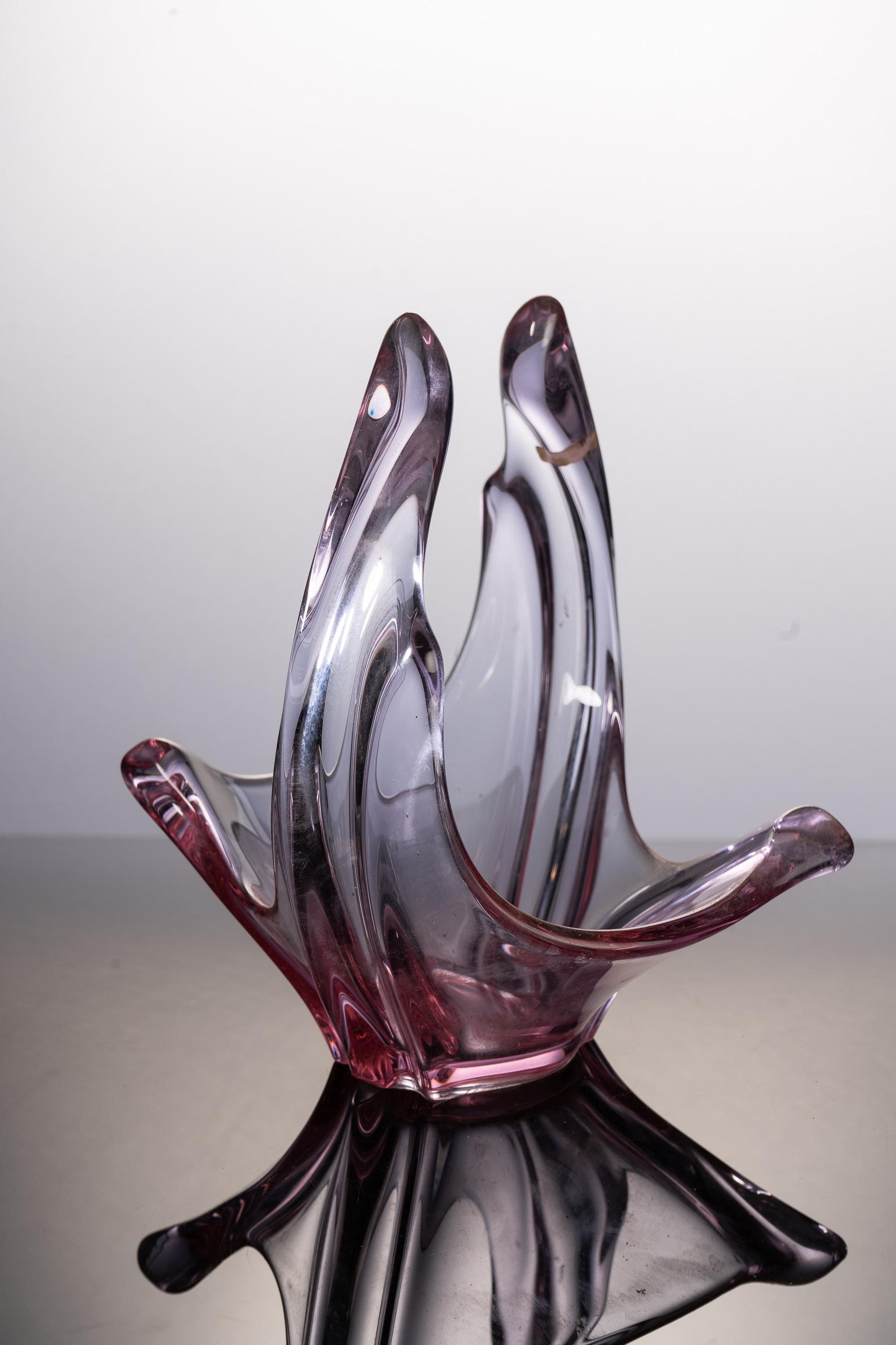 Stunning hand blown glass vase. This very decorative item with beautiful light purple and pink hues is an absolute feast for the eyes and is in perfect condition.