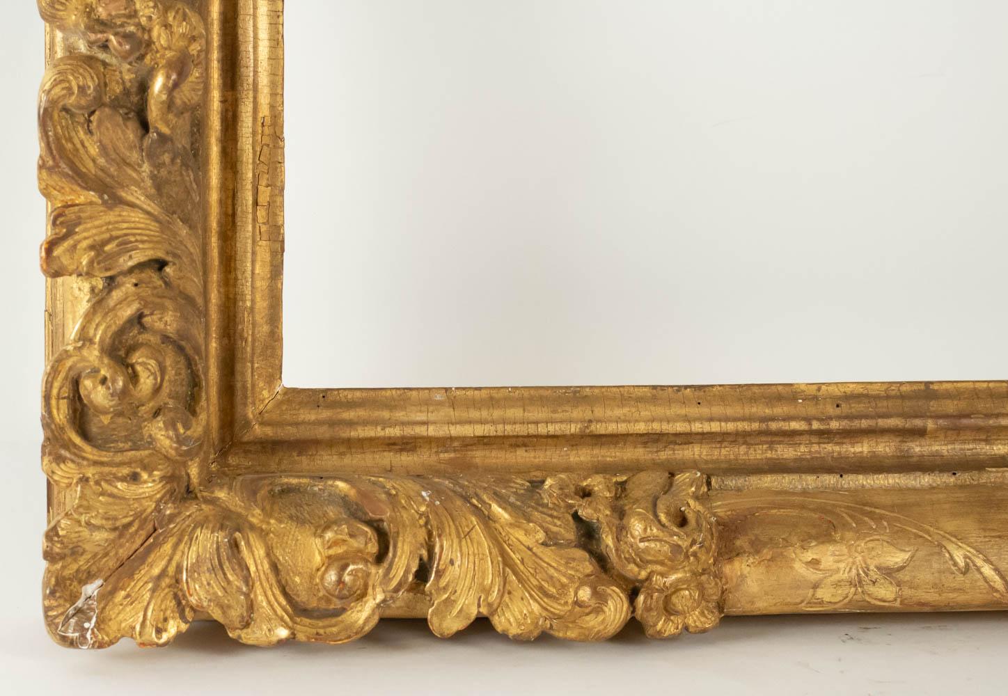 Fabulous Louis XIV period hand-carved giltwood frame - mirror with flower corners, France, late 17th-early 18th century.
Sight size is: 61.5 cm x 61.5 cm
Overall size is: 78 cm x 78 cm.
 