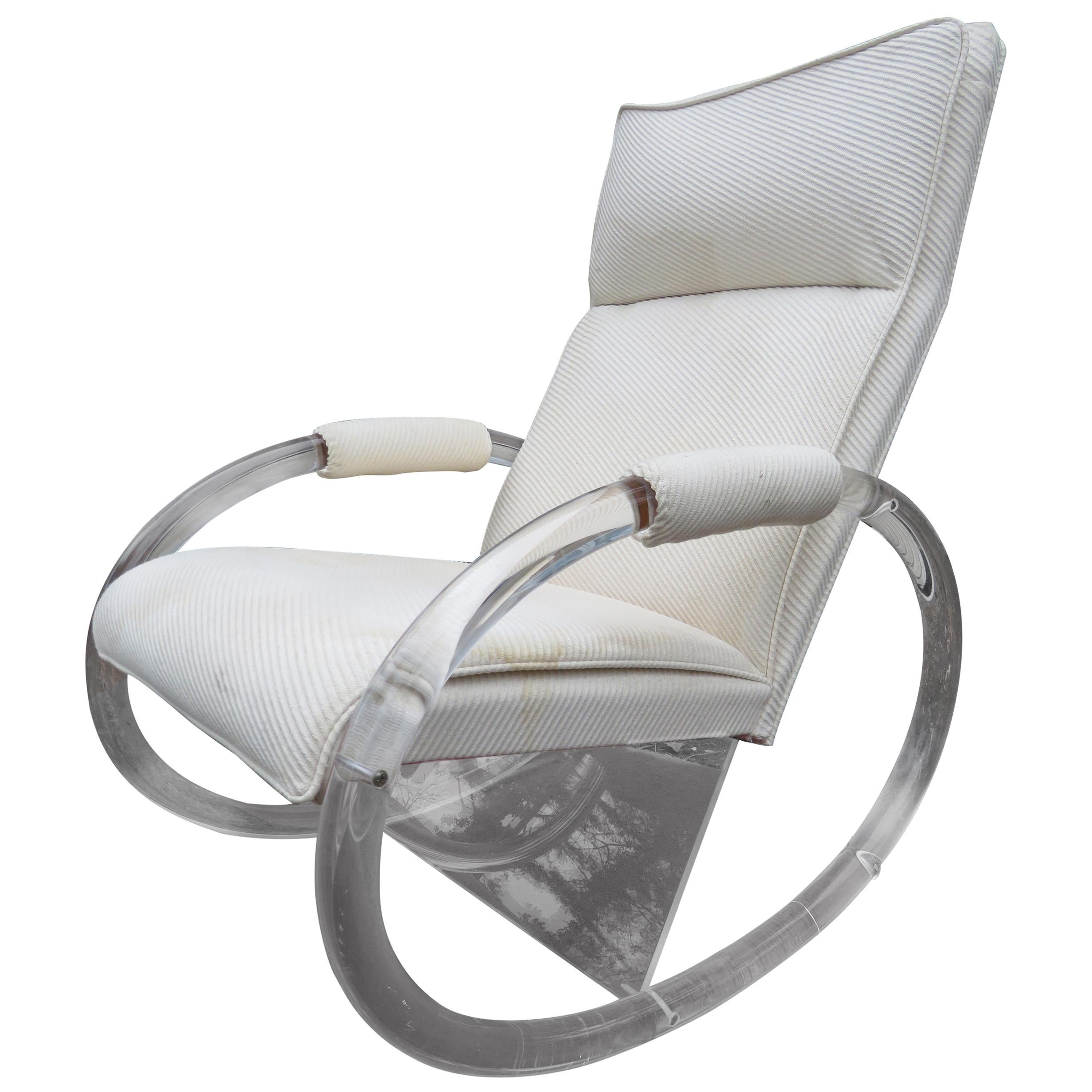 Fabulous Lucite rocking chair designed by Charles Hollis Jones in the 1970s and made by Hill Manufacturing Corporation.
The lounge chair has the original beige cotton upholstery in worn condition-reupholstery is recommended. It measures 37