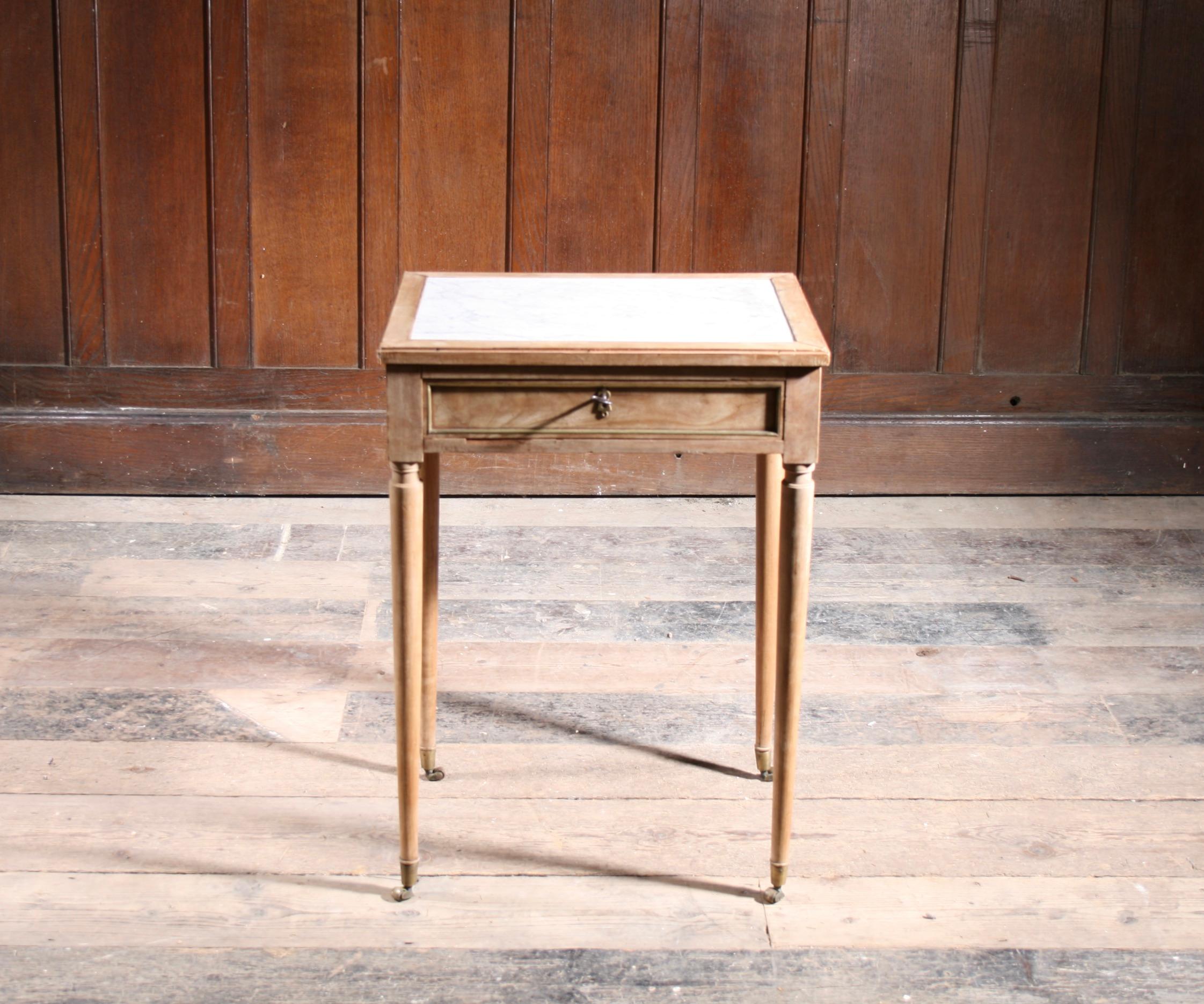 Fabulous Maple & Carrara Marble Table, with brass beading.  Dating from the early 19th century and stamped by renowned French cabinet maker.

Very good unrestored original condition.