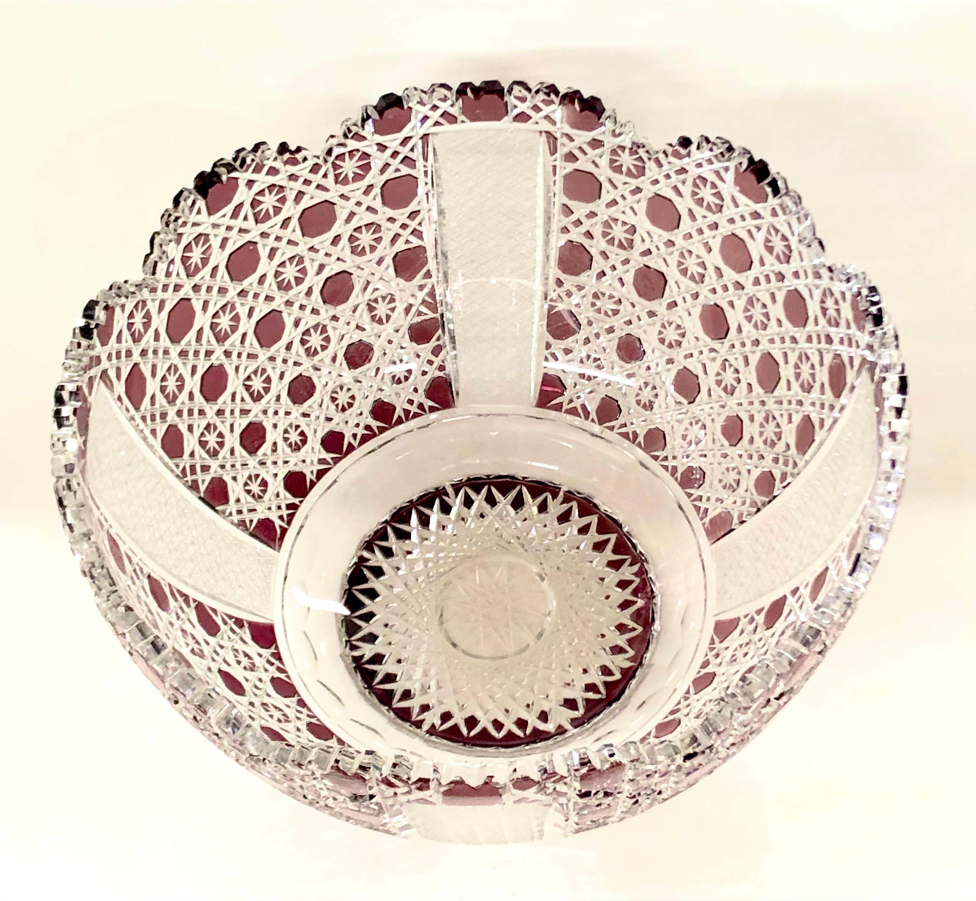 Mid-20th century Bohemian amethyst/cranberry cut-glass punch bowl, with crenellated and scalloped rim, cut overall with cross-cuts accented with star-cuts, similar to 