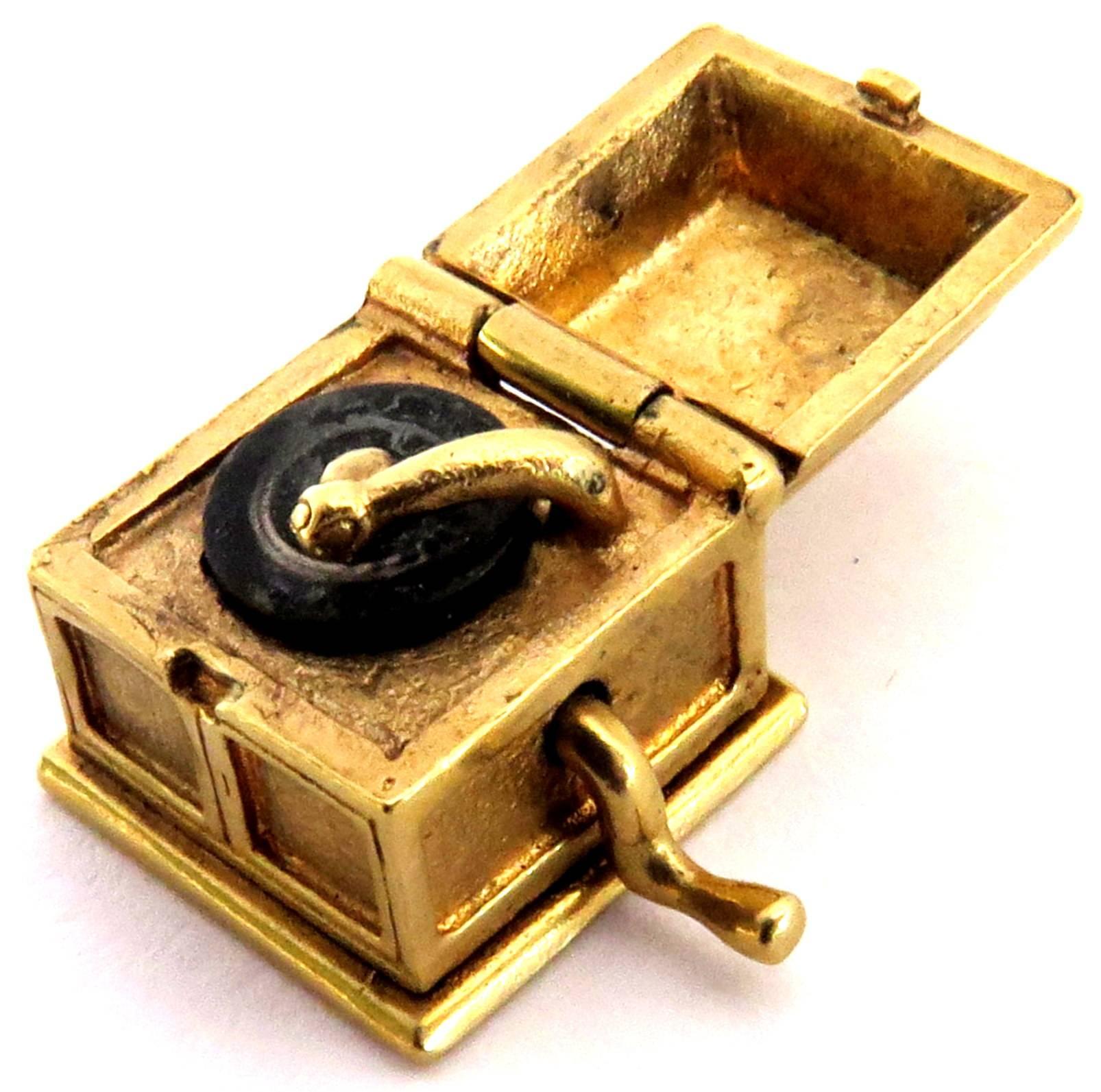 This wonderful 14k record player charm pendant opens to reveal a record on the turntable and has a crank on the side that turns.
This charm weighs 5.6 grams
This charm when opened measures 3/4 inch by 7/16 inch

