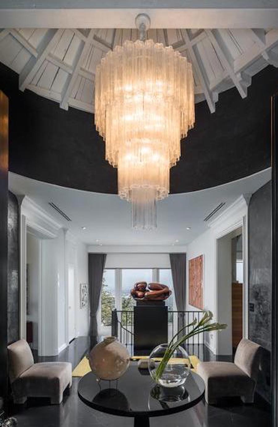 Extraordinary chandelier by Toni Zuccheri for Venini composed by 79 Tronchi 45 cm high.
18 light bulbs 
Available the pair.
 