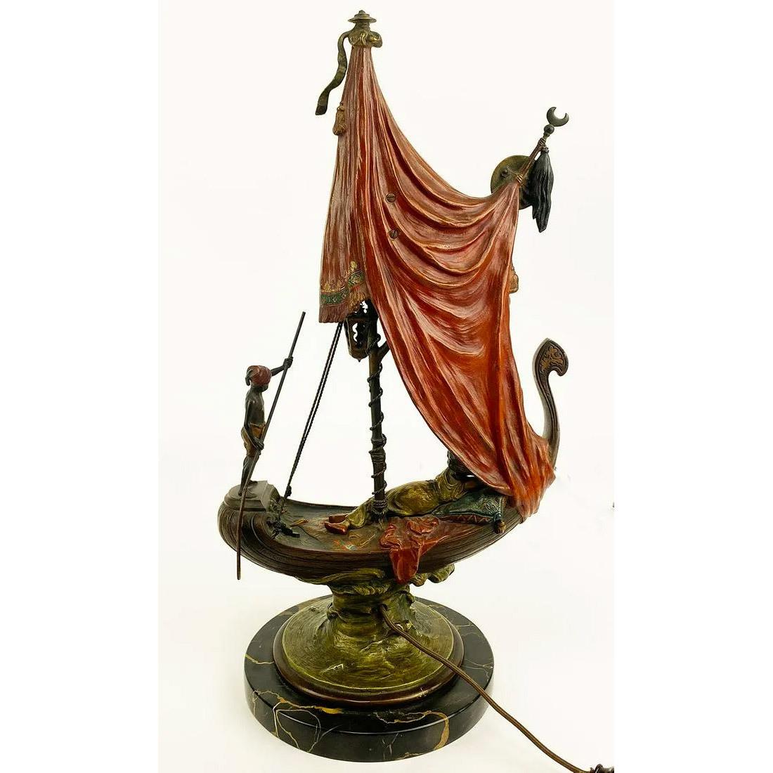 A fabulous rare cold painted bronze lamp and sculpture depicting Cleopatra sailing on her barge, marked B and inscribed Namgreb.