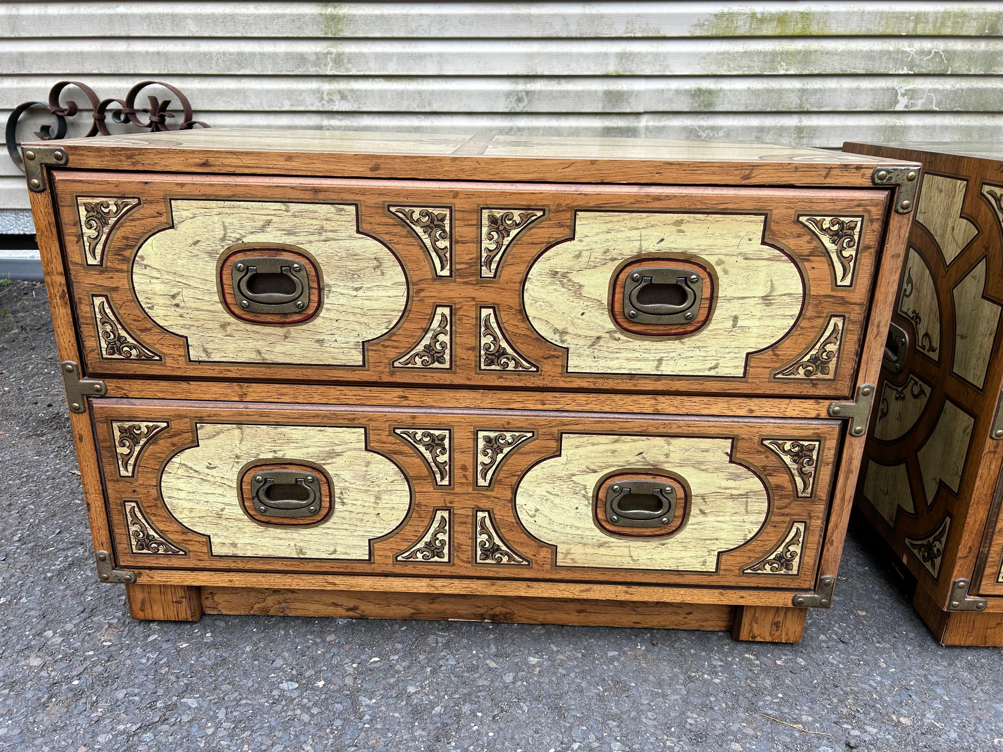 Fabulous pair of extremely rare Campaign chests by Drexel for the Oxford Square Collection.  We just love the unusual patterns on all sides done with different colored stains and painted details.  We have never seen another pair come to the