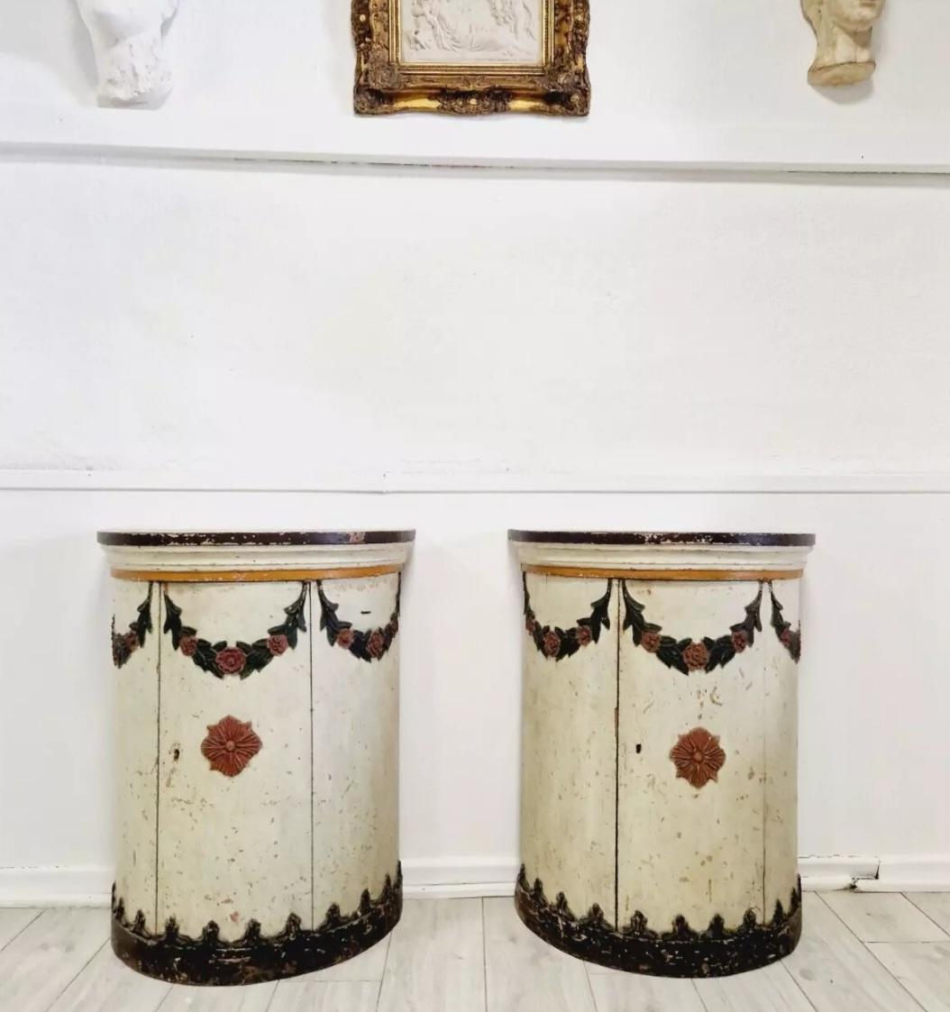 This exceptional pair of Italian Polychromed drum cupboards from the 18th century that exude elegance and grandeur. The design and craftsmanship of these Cupboards are a testament to the Louis XVI style that was prominent during the era of Louis