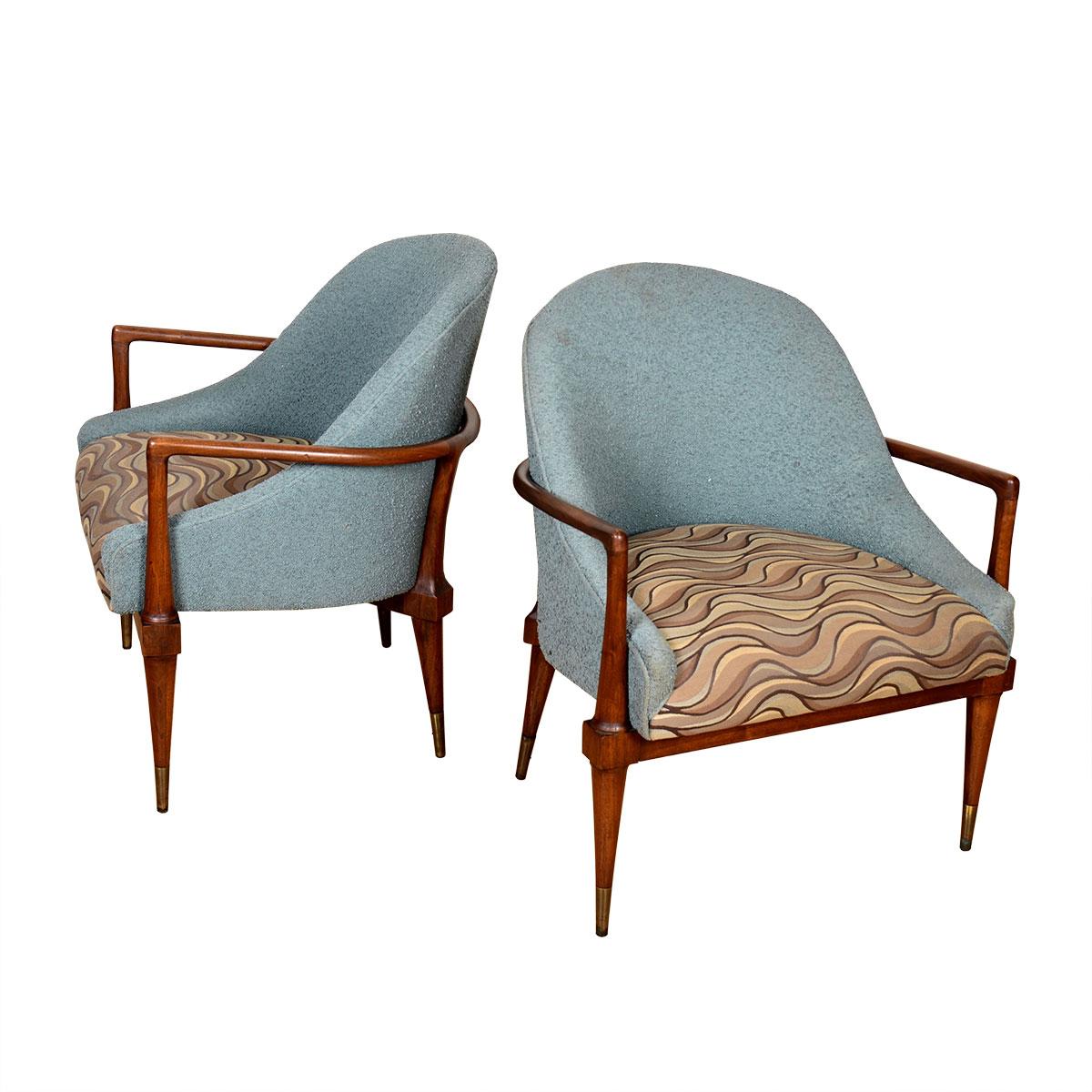 An open walnut frame nestles a fully upholstered seat on these gracious chairs by Thomas Robbsjohn-Gibbings. The rounded frame is echoed in by the rounded shape of the backrest. Beautiful details on the chair frame attest to the high quality