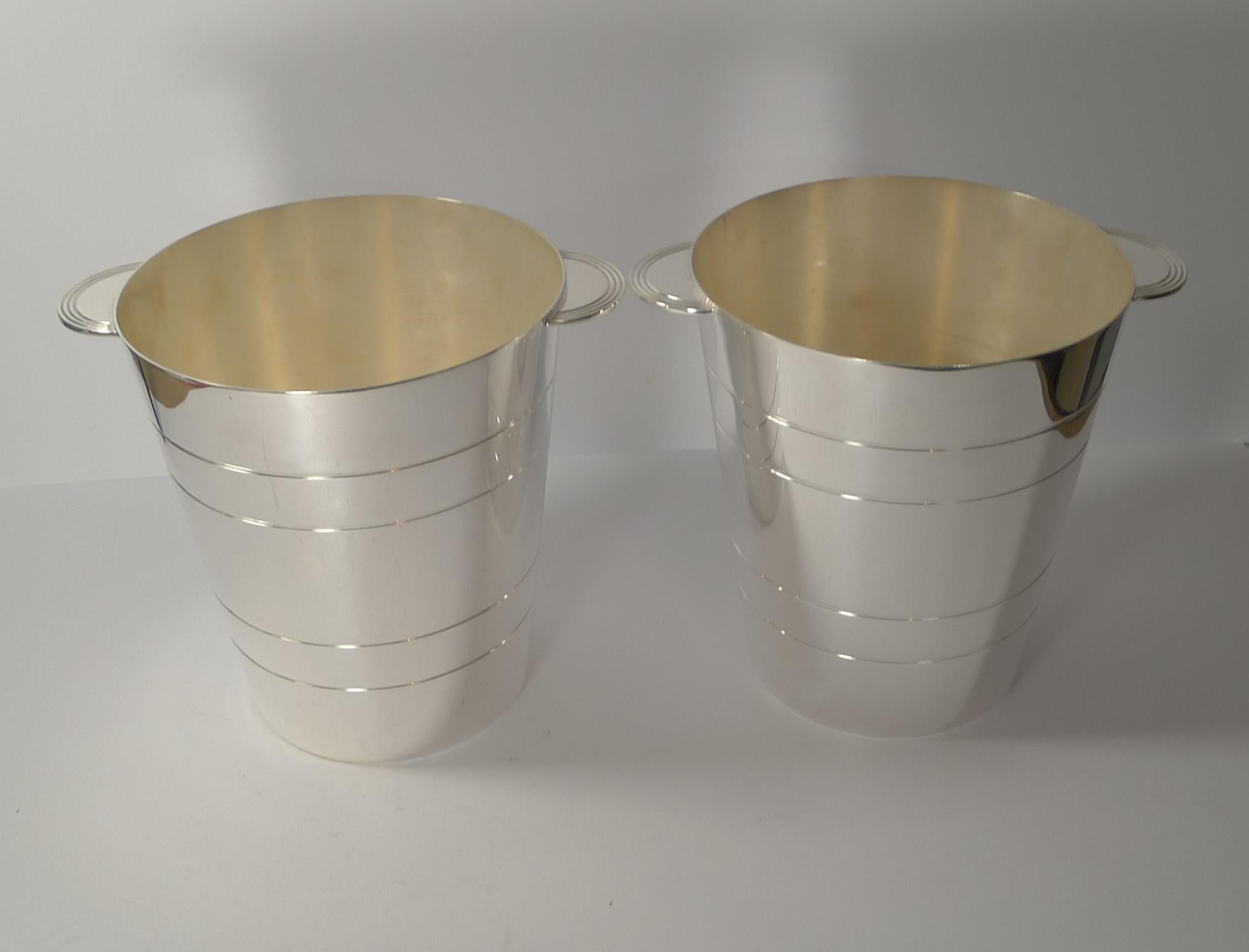 A truly fine pair of vintage English silver plated wine coolers or buckets Art Deco in style and as fashionable today as they were sixty years ago, a true classic style.

Just back from our silversmith, professionally polished to shine with all
