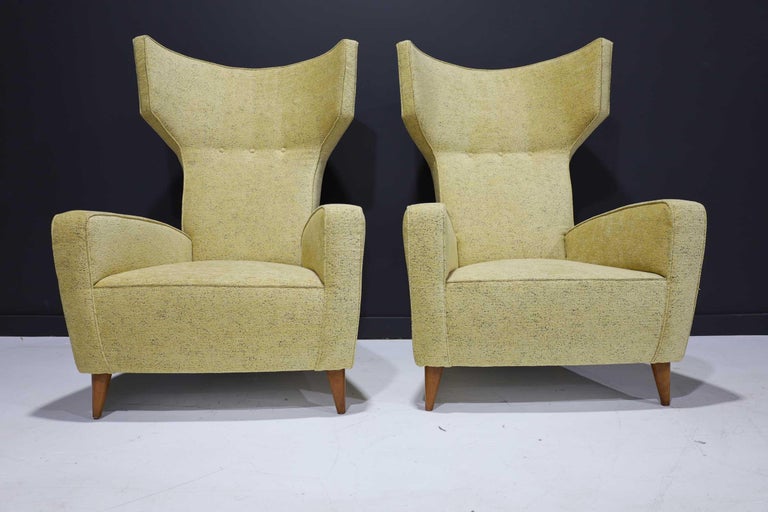 Large-scale club chairs in the spirit of Gio Ponti, Paolo Buffa, Carlo Mollino with high backs and great detailing. Tapered wood cone feet and chenille woven upholstery. Very good quality fabric.