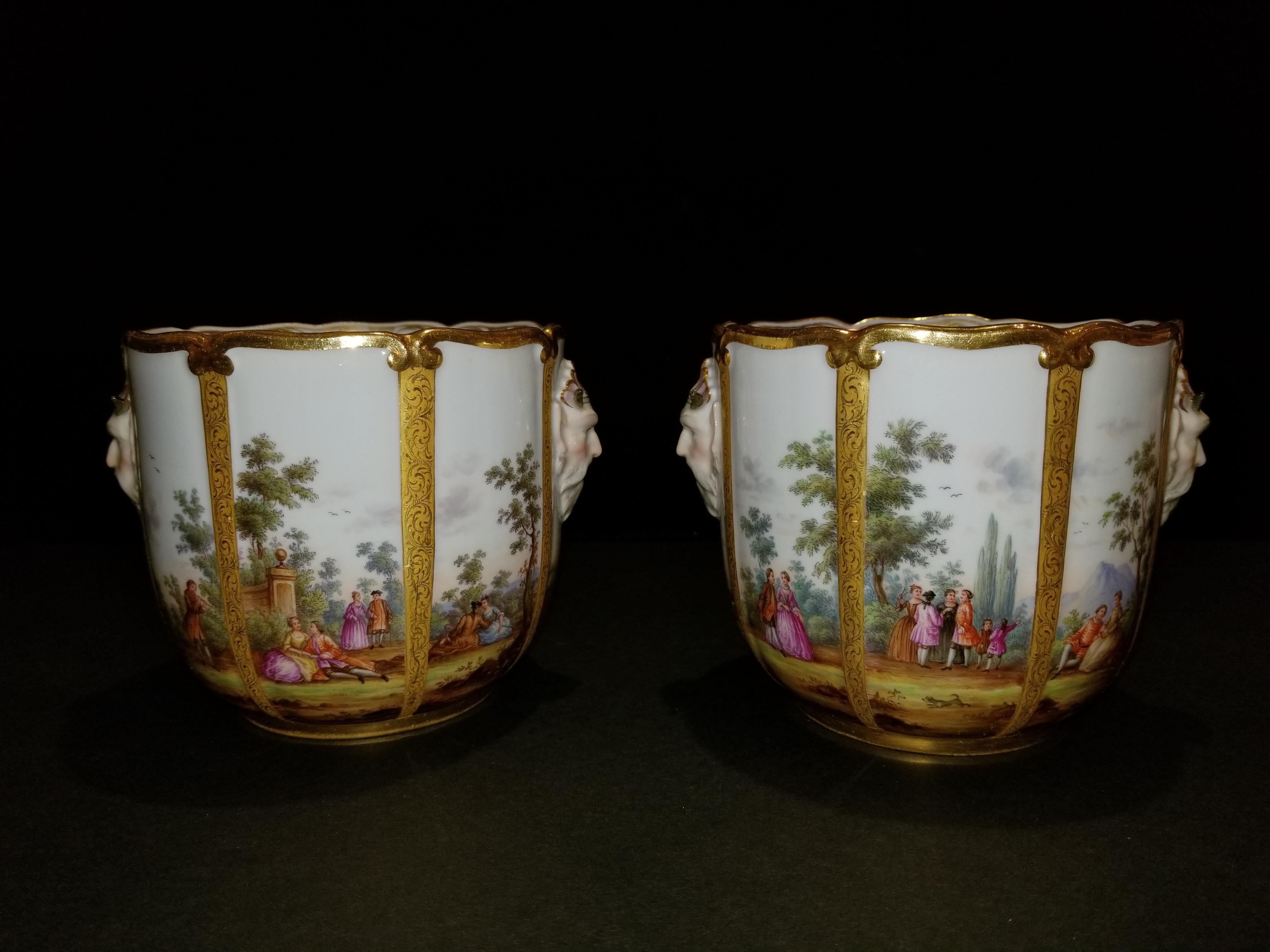 A fabulous pair of Meissen Porcelain glass coolers/cachepots. This exceptional pair of exquisitely hand-painted Meissen Porcelain glass coolers are each painted with panels of figures in a landscape, which include harbor as well as equestrian