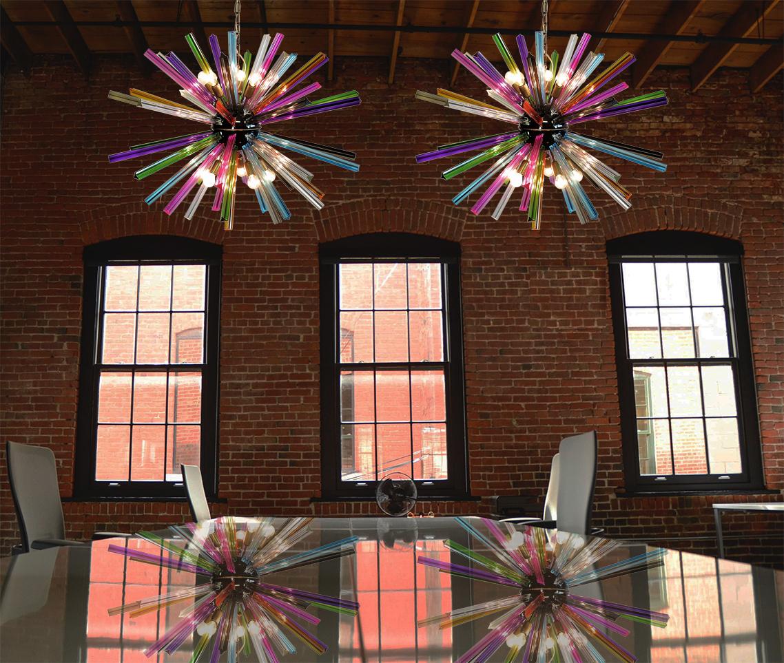 Pair Sputnik chandelier surrounding 50 multicolored crystal glass 'triedri' prisms radiating from a centre black metal nucleus. Brass lamp holder.
Period: Late 20 century
Dimensions: 51.20 inches (130 cm) height with chain; 27.55 inches (70 cm)