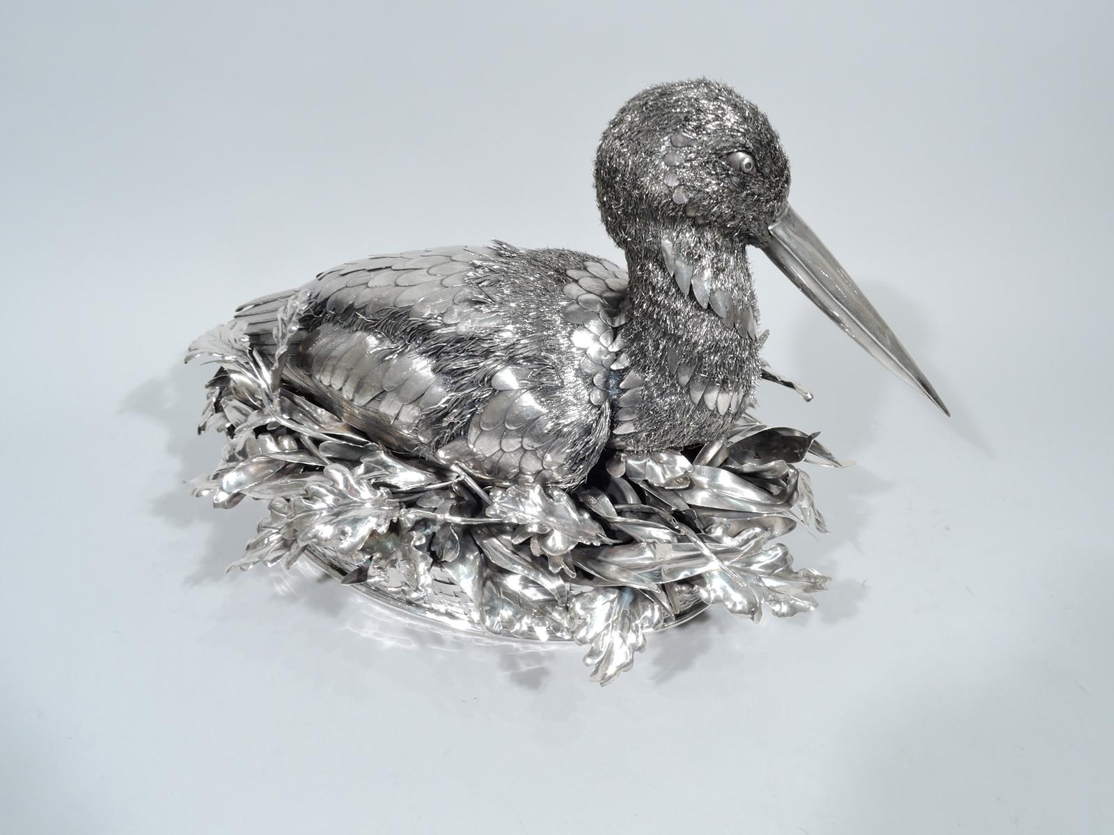 Fabulous quality silver bird. Made by Mario Buccellati in Milan, circa 1930s. Bird in tucked-in mode with wings close to body. Imbricated feathers heightened with engraving as well as bristly wire down. Head turned to side with long closed bill. A