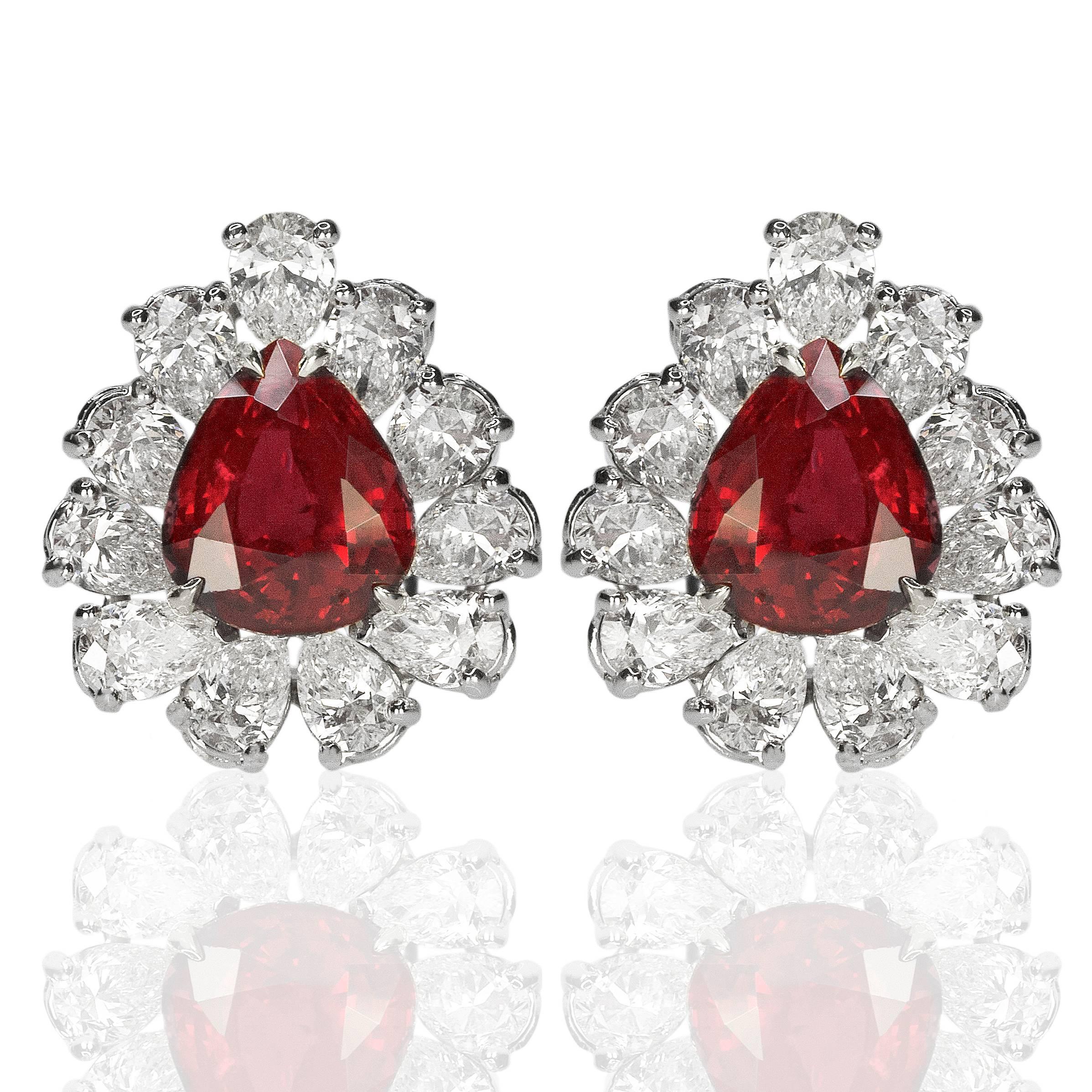 PL & 18k Earrings with 2 Dunaigre certified pear shape rubies weighing 4.70 & 4.56 carats and 22 pear shape diamonds weighing approximately 6.00 carats.
