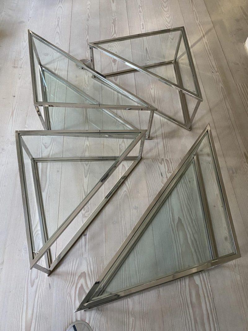 Fabulous set of 4 coffee tables, with chrome profiling, in alternative triangular designs, with glass shelves on both levels.

Dating to the 1960s, but in art deco style, and can be put together in different positions. Super stylish decor