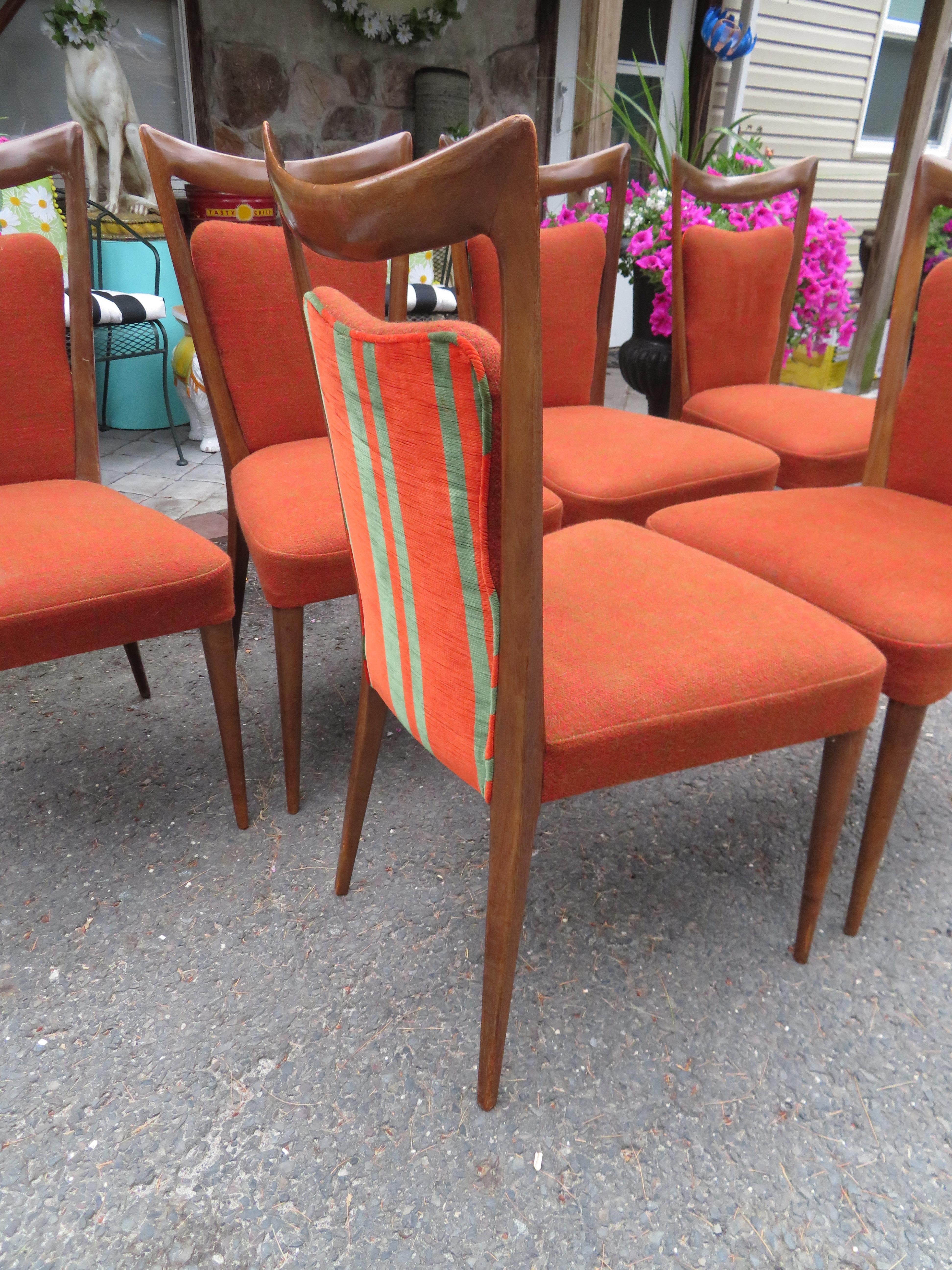Fabulous Italian set of 6 Melchiorre Bega sculptural dining chairs. These chairs retain their original fabric in usable condition-we do recommend cleaning or re-upholstery. These chairs measure 37.5