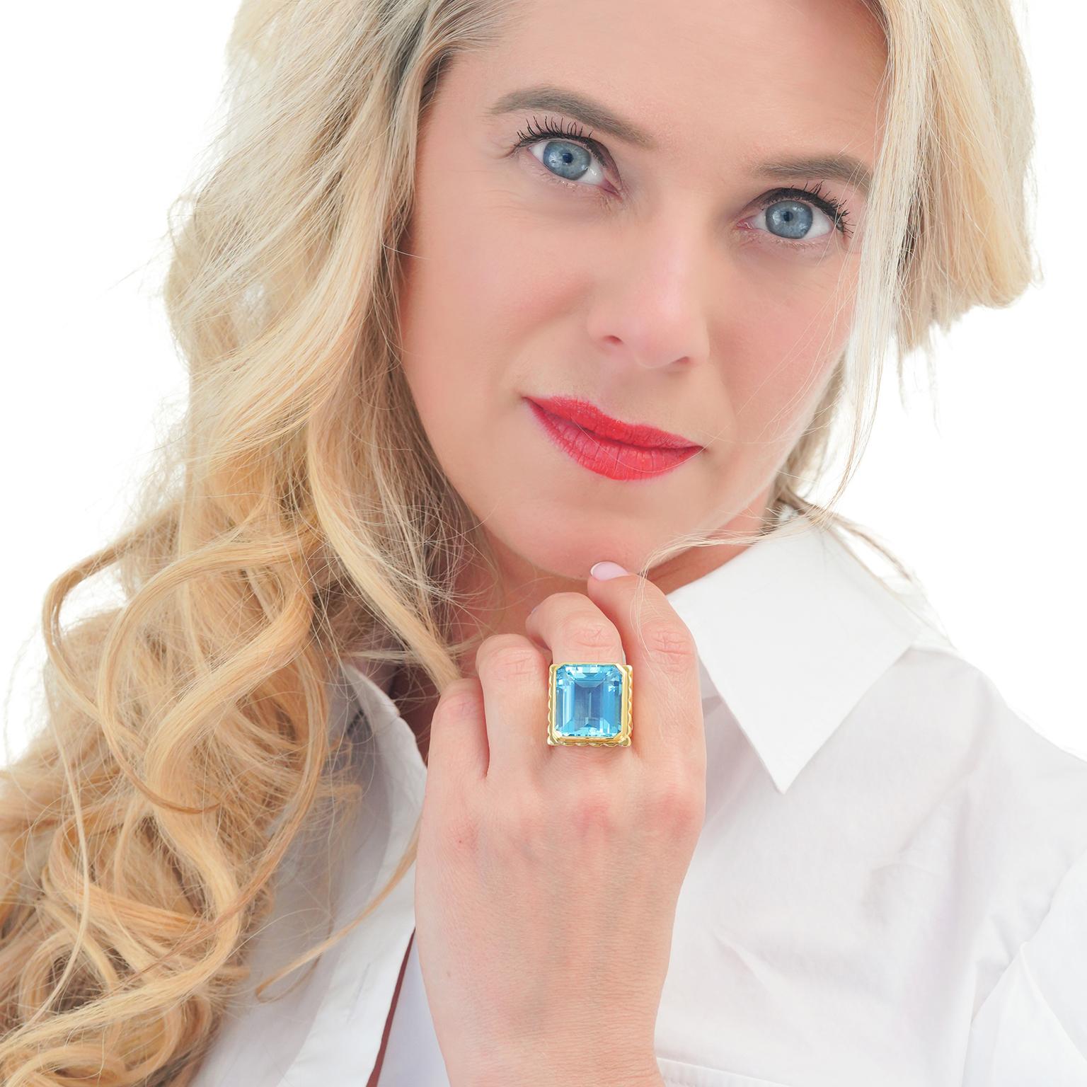 Circa 1970s, 18k.  This big bold fashion ring is all about color. Its sleek seventies design perfectly showcases the vivid 25.0-carat aquamarine. One-of-a-kind, this custom-made ring is meticulously fabricated in 18k yellow gold. Excellent