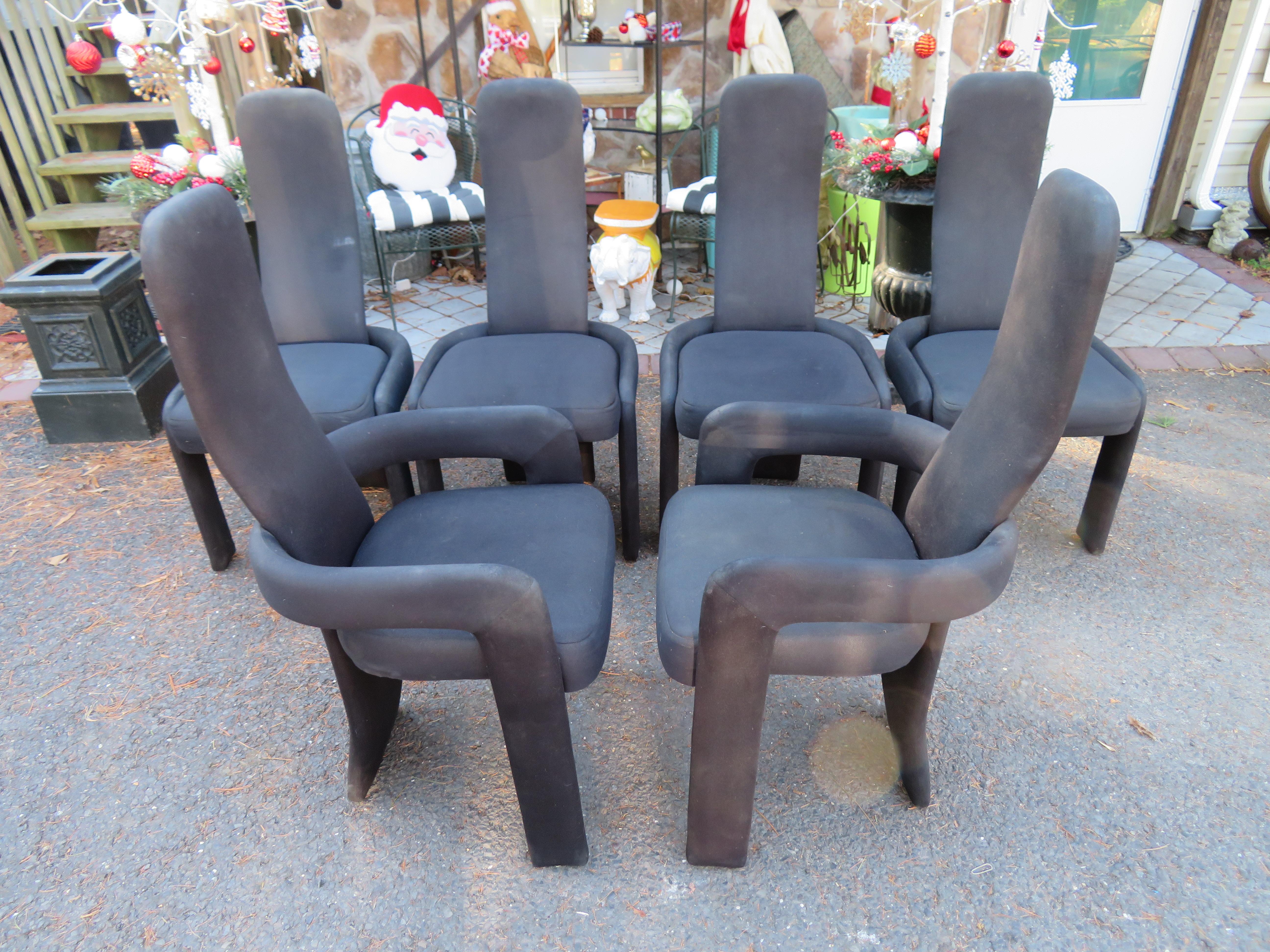 Statuesque set of six Postmodern tall back chairs, four side chairs and two armchairs. They each have tall, narrow backs with rounded top corners and a lumbar curve, extending down to the floor, while the seat is nestled in a curved support that