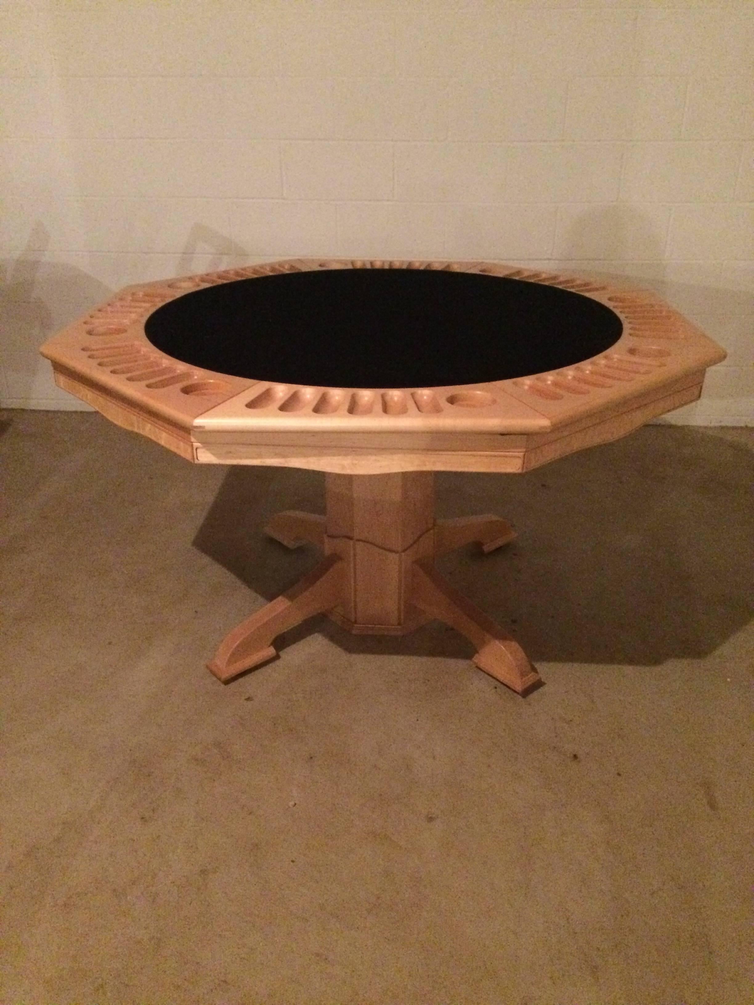 Very glamorous and beautifully constructed octagonal Carpathian Maple game table having one side outfitted for playing poker with black felt and indentations for chips, coins, cards and the like. The top lifts off and have a backgammon board on the