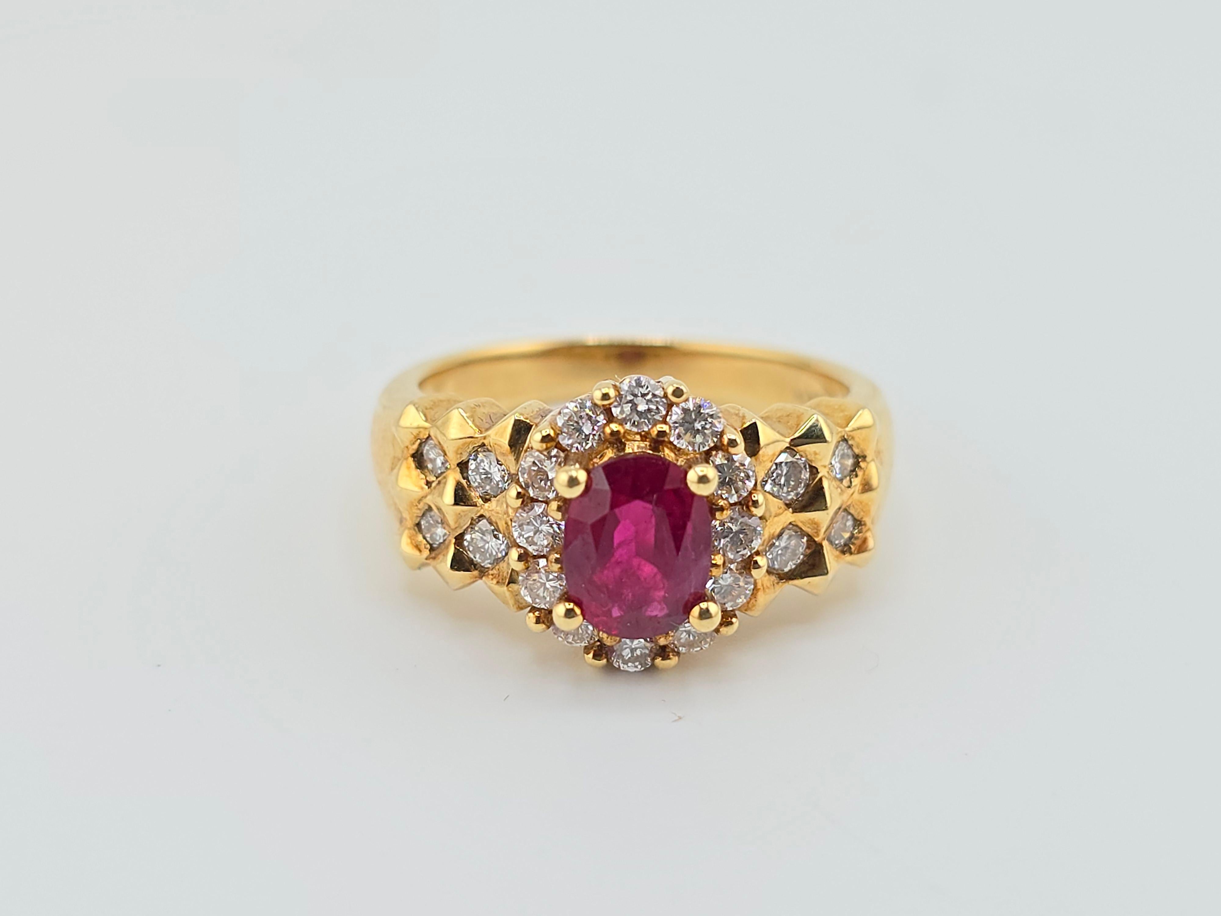 This is a fabulous 18 karat yellow gold ring with super clean diamonds and a gorgeous natural ruby center stone. The quality on the ruby is very exceptional with a nice, deep, rich, red purplish color. And all around the ruby l there are nice round